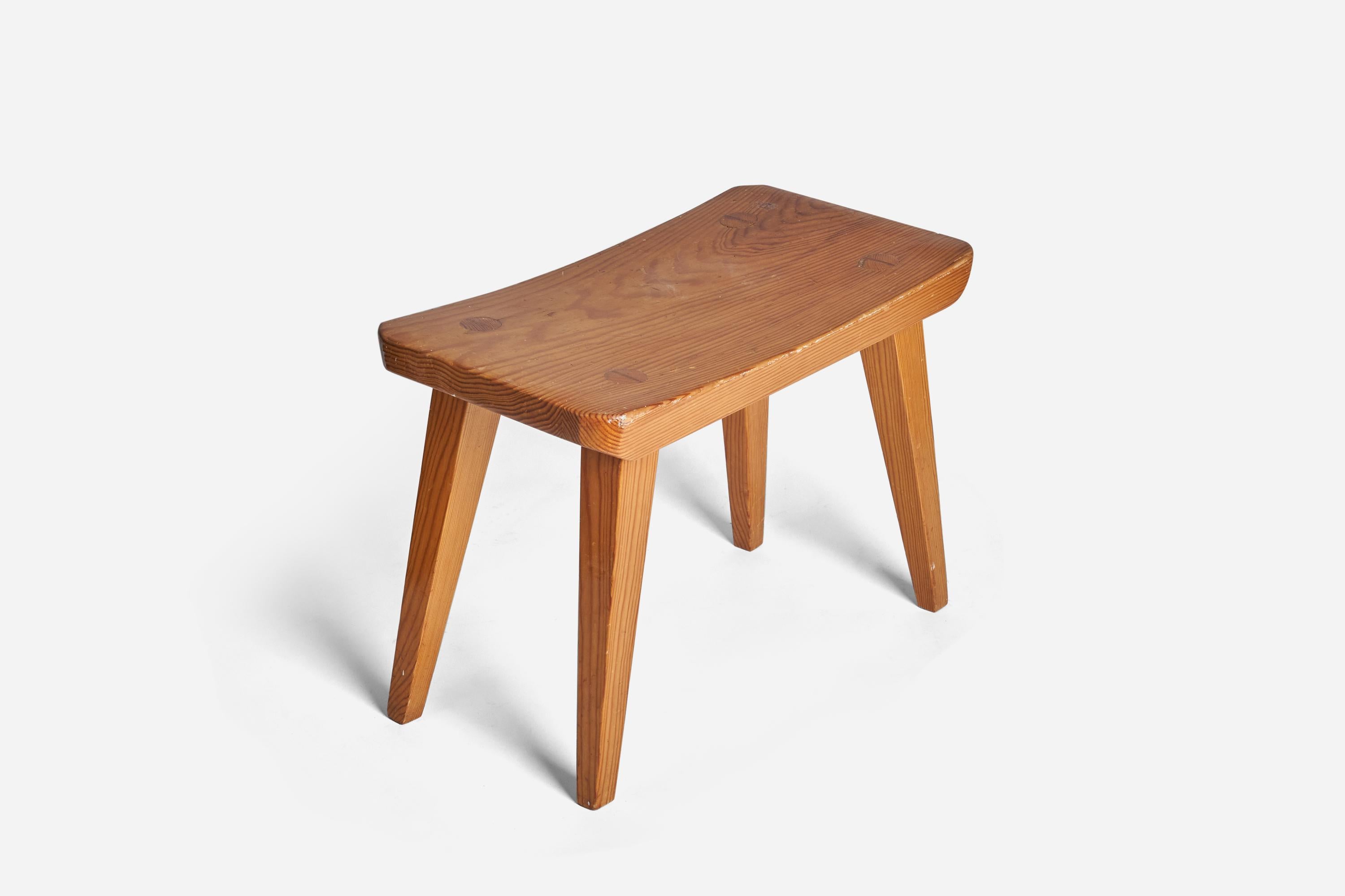 A solid pine stool designed and produced in Sweden, 1960s. 