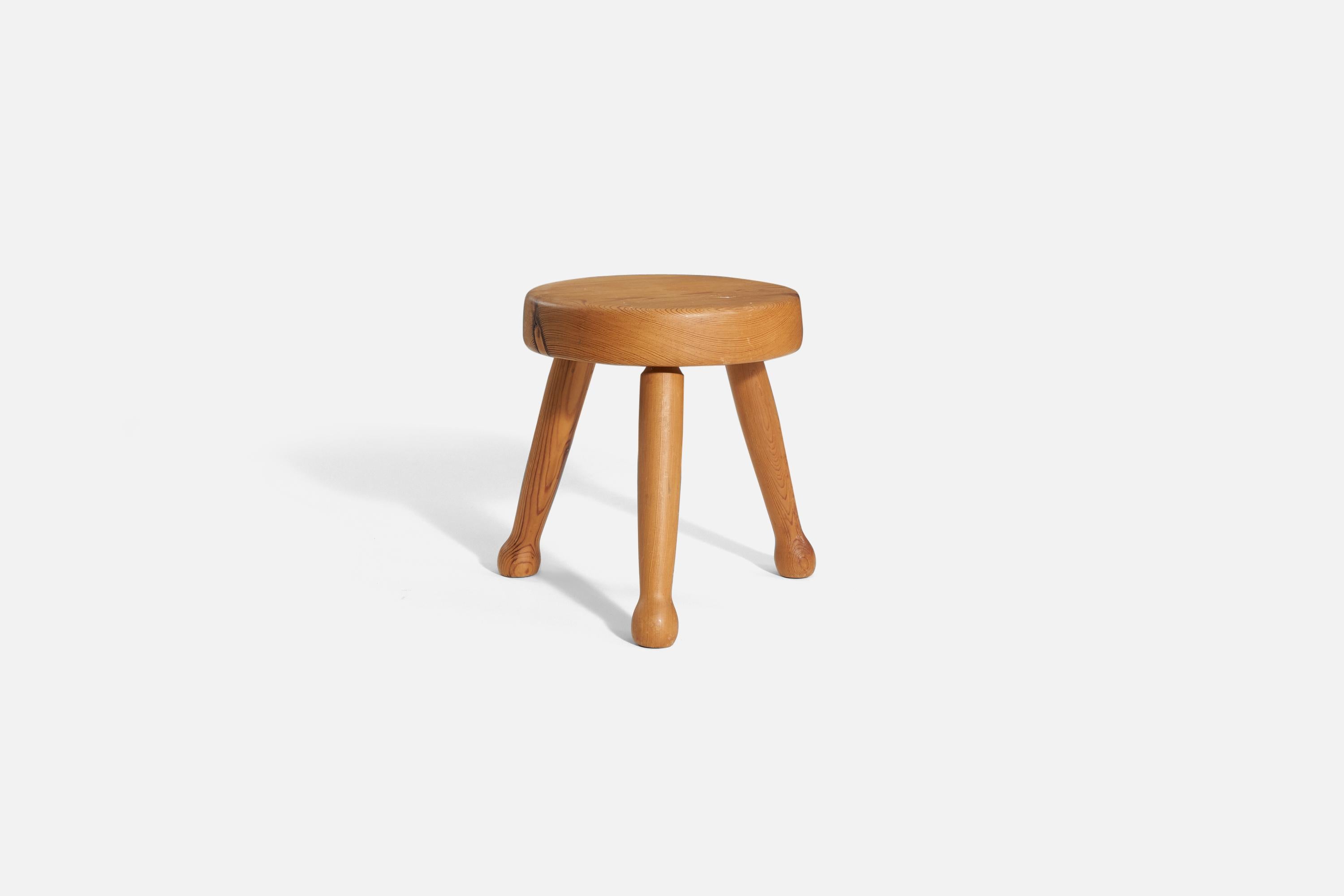 A solid pine stool, produced in Sweden, 1970s.
