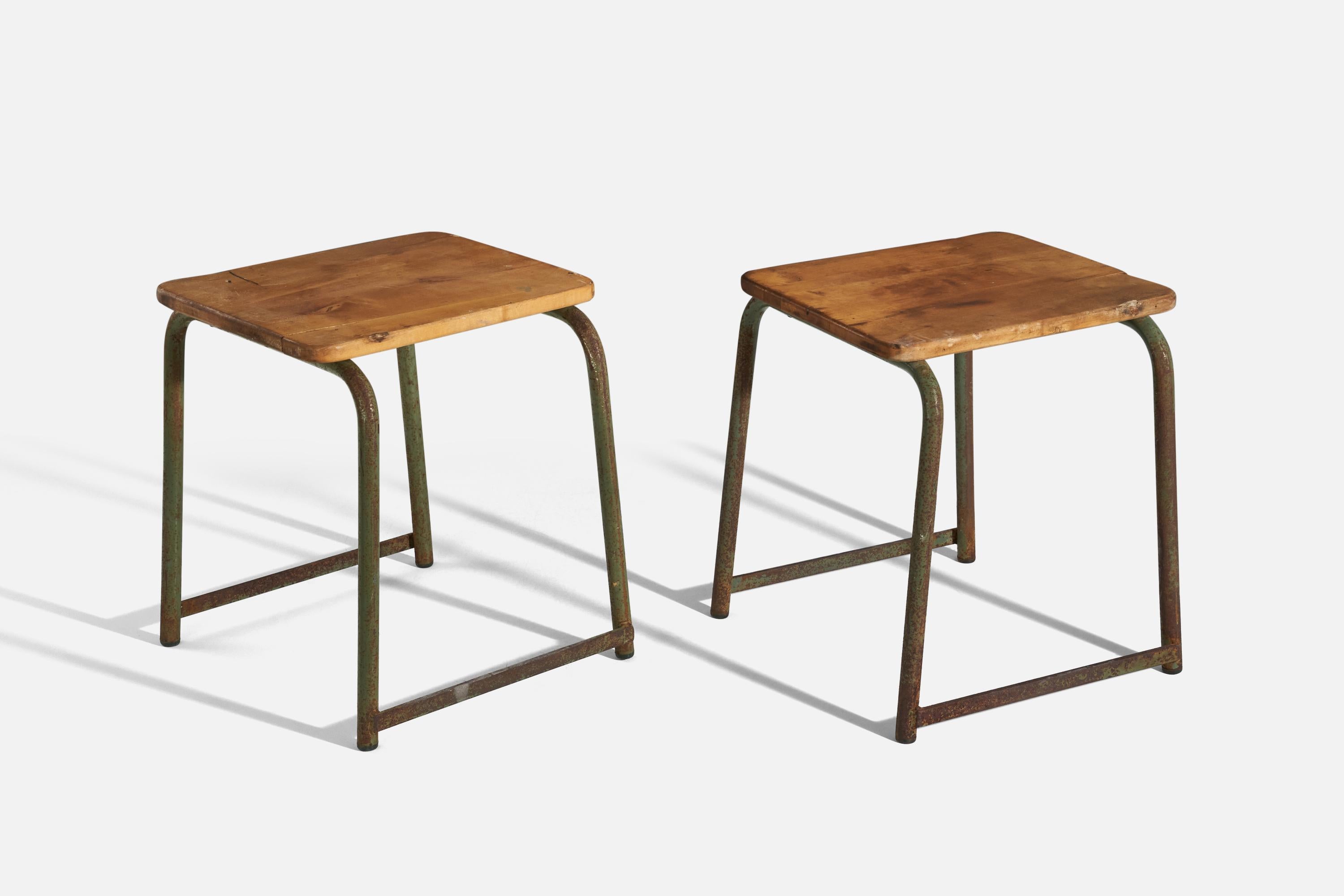 A pair of oak and green-painted metal stools designed and produced in Sweden, 1940s. 
  