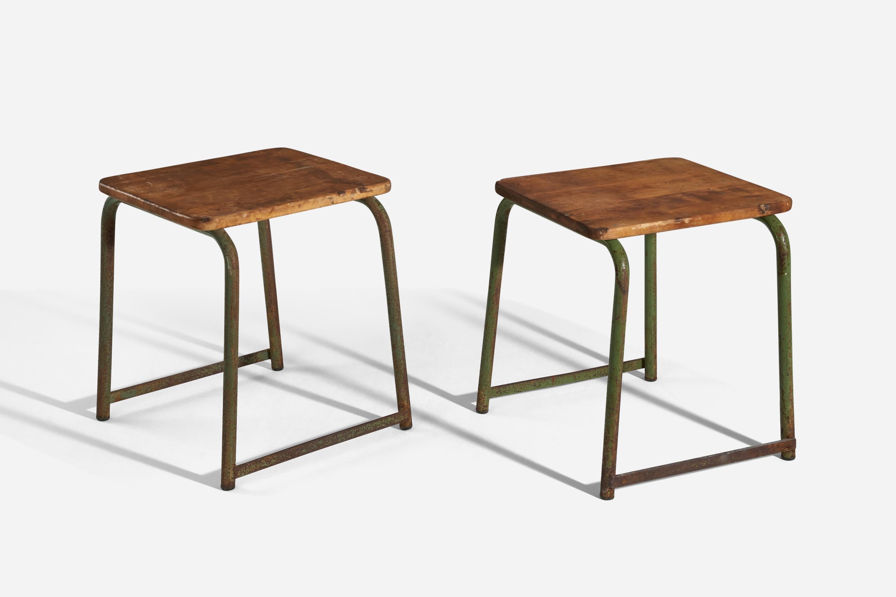 A pair of oak and green-painted metal stools designed and produced in Sweden, 1940s. 

  