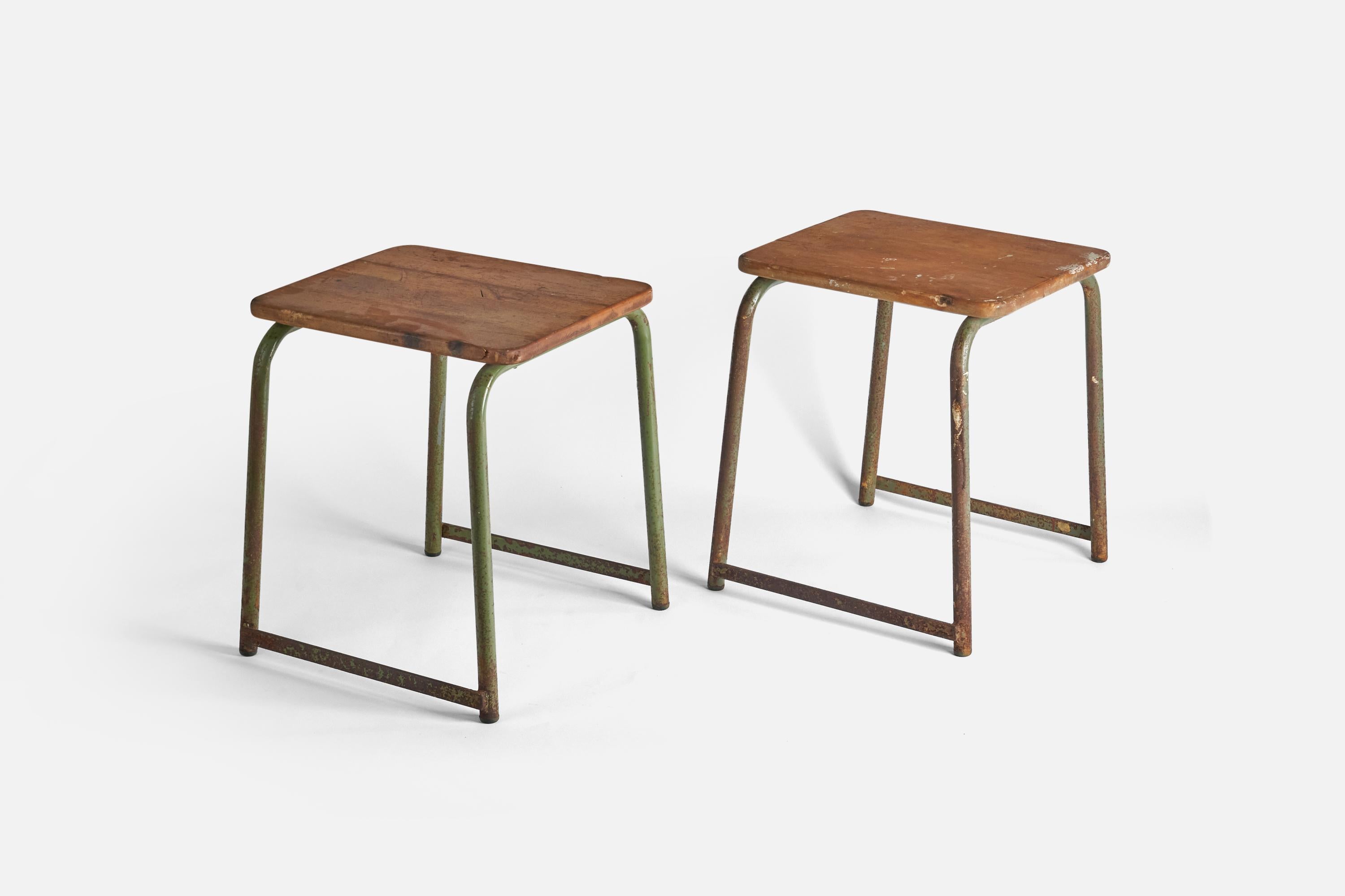 A pair of oak and green painted metal stools designed and produced in Sweden, 1940s. 

  