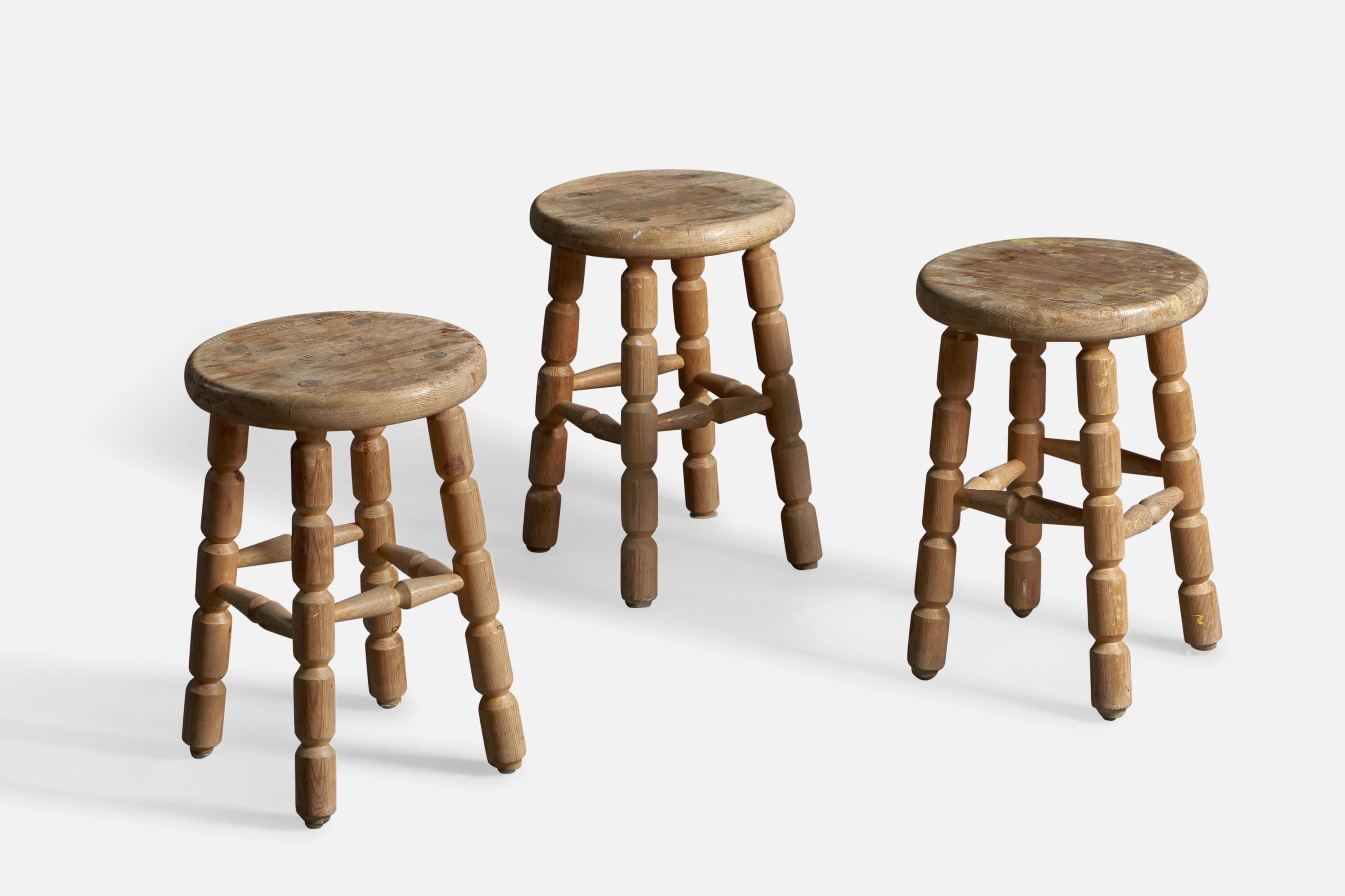 A set of 3 solid pine stools, designed and produced in Sweden, c. 1960s.