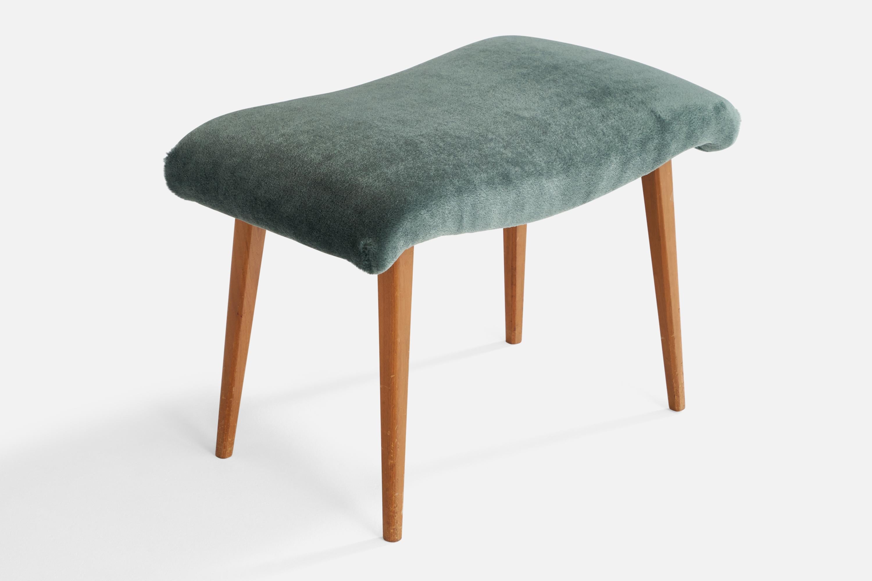 A wood and blue mohair stool designed and produced in Sweden, 1940s.

Seat height: 16”