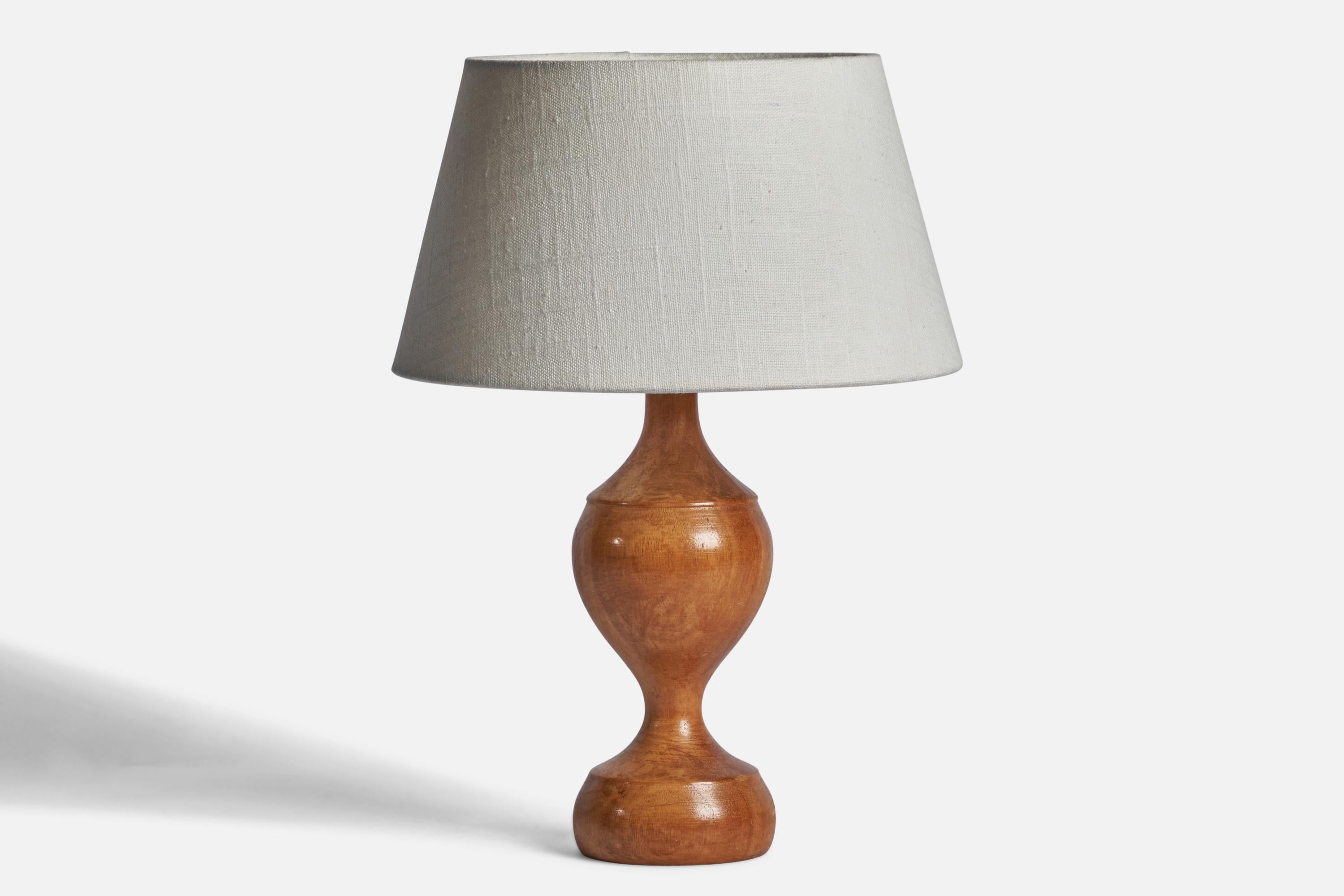 A birch table lamp designed and produced in Sweden, 1960s.

Dimensions of Lamp (inches): 11.35” H x 3.5” Diameter
Dimensions of Shade (inches): 7” Top Diameter x 10” Bottom Diameter x 5.5” H 
Dimensions of Lamp with Shade (inches): 14” H x