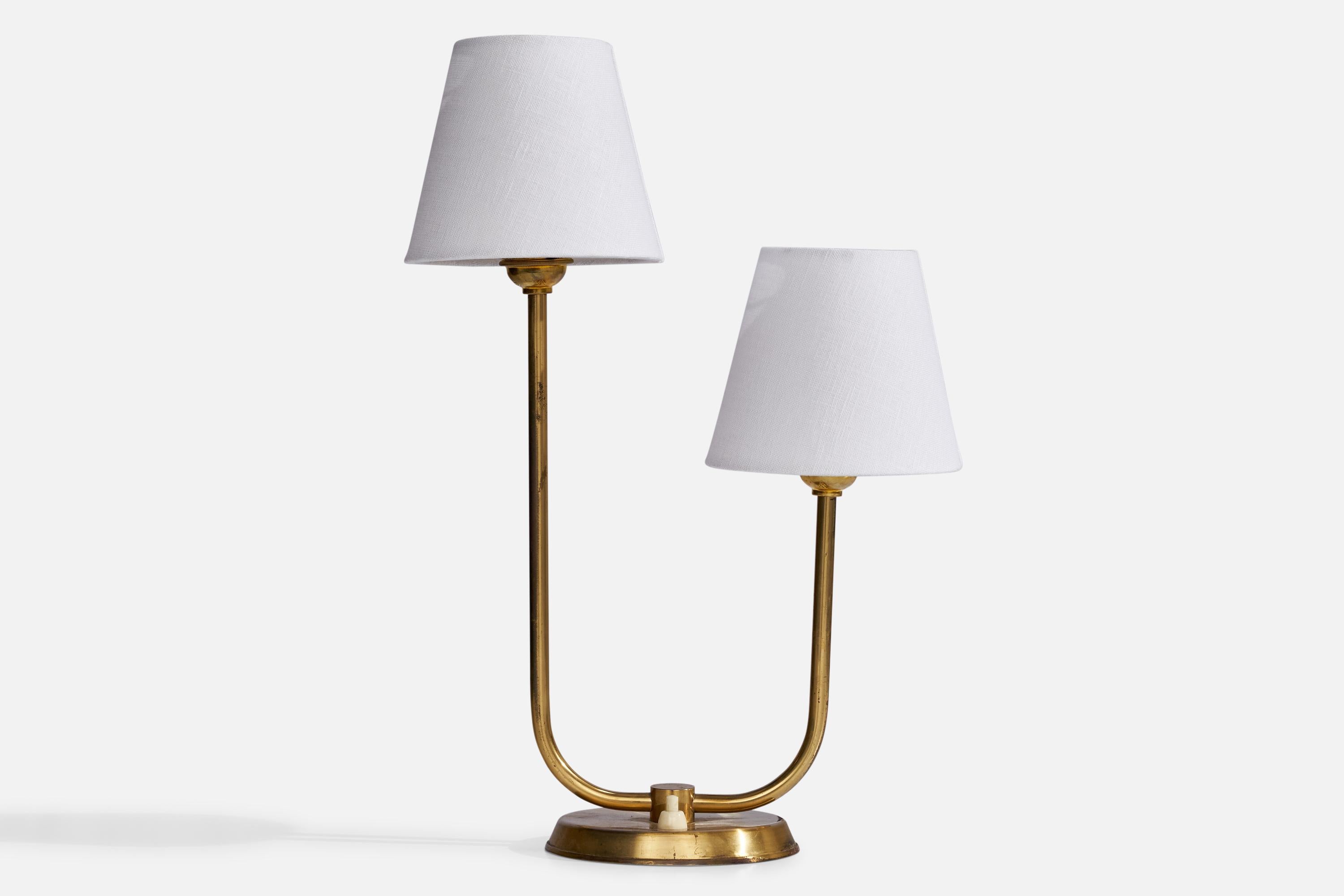 A two-armed brass and white fabric table lamp designed and produced in Sweden, 1940s.

Dimensions of Lamp (inches): 13.3” H x 7.25” W x 5.15” Depth
Dimensions of Shade (inches): 3”  Top Diameter x 5” Bottom Diameter x 4.5” H
Dimensions of Lamp with