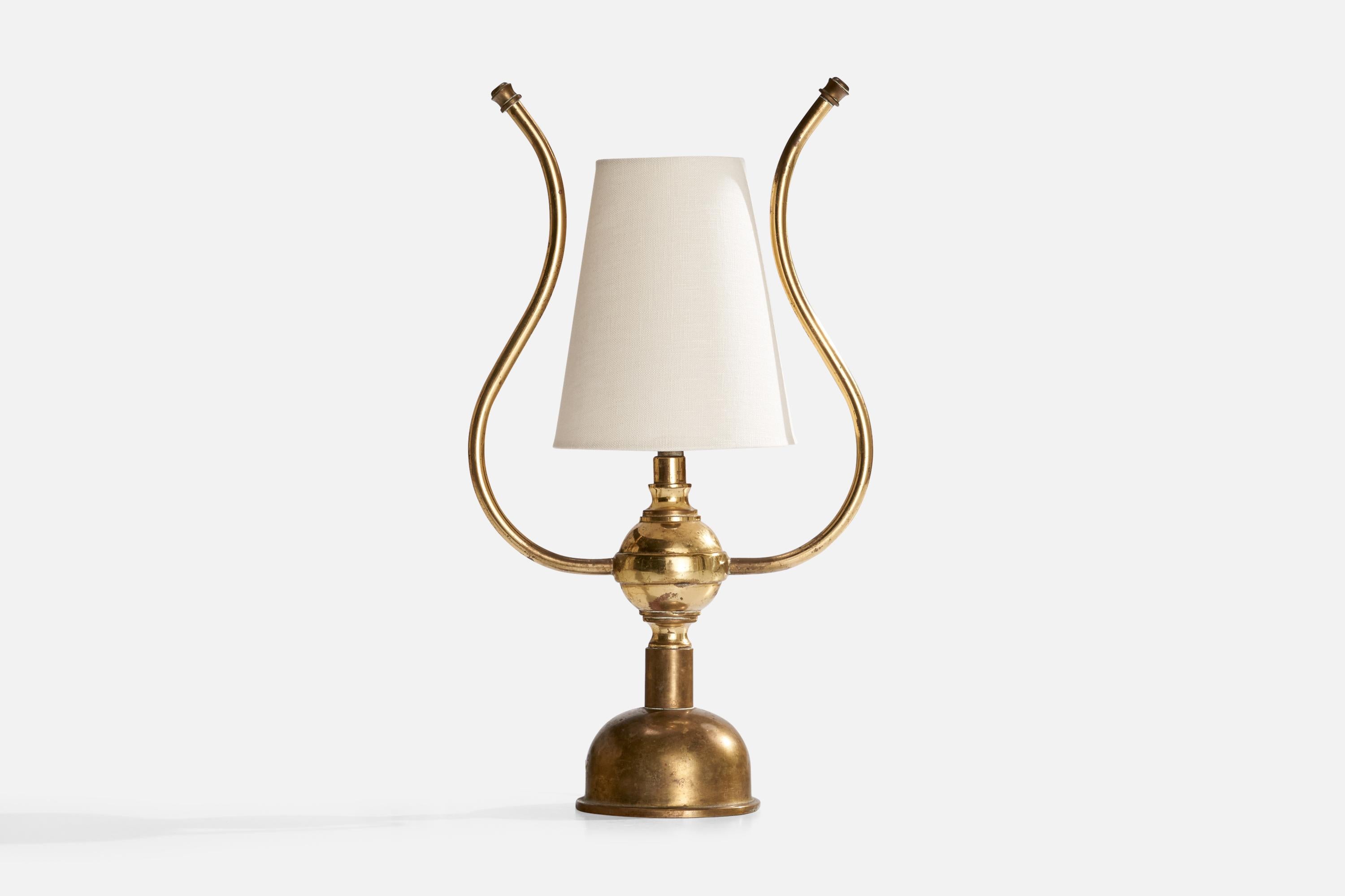 A brass and white fabric table lamp designed and produced in Sweden, c. 1940s.

Dimensions of Lamp with Shade (inches): 15.25” H x 8.5” W x 5