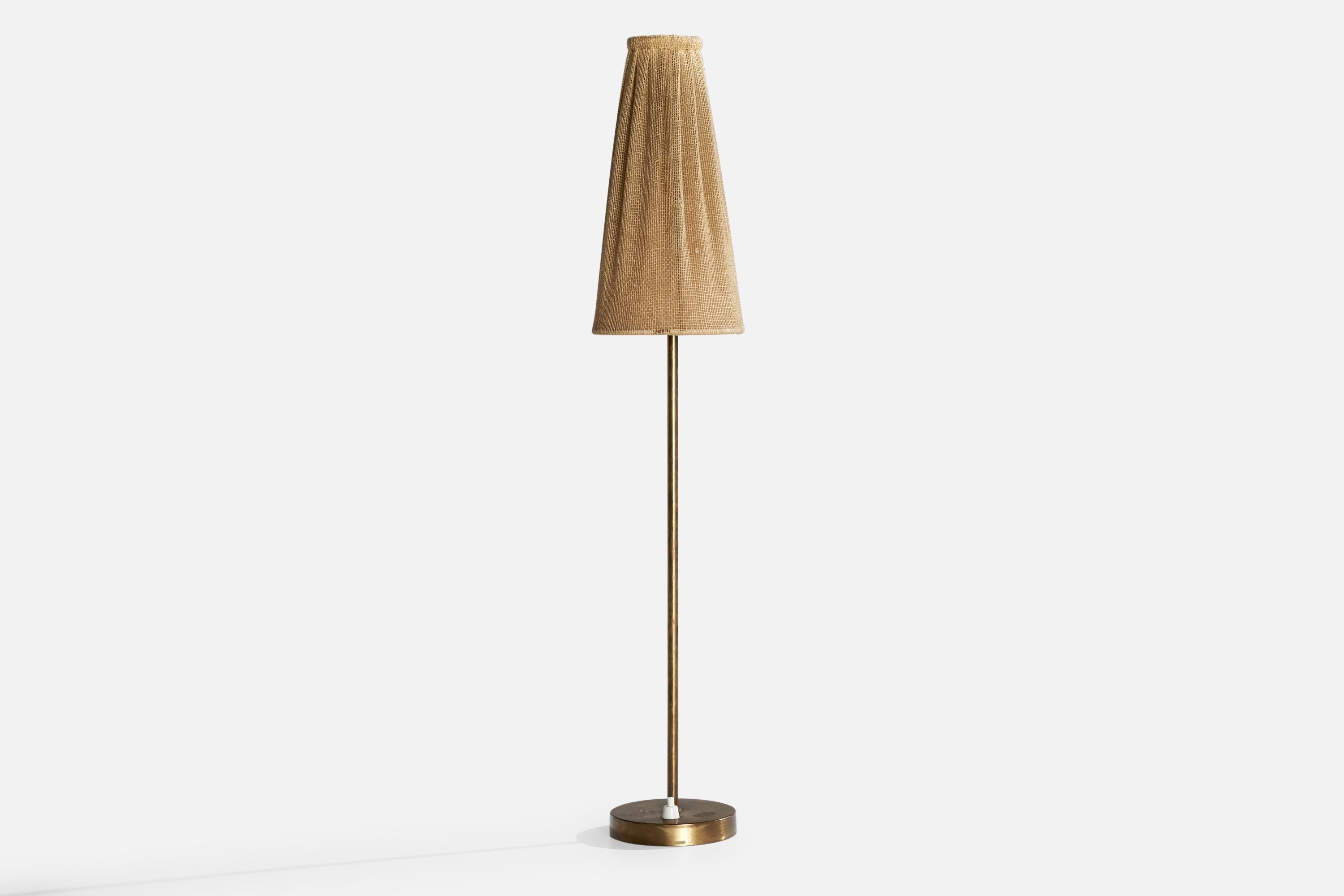 A brass and beige fabric table lamp designed and produced in Sweden, c. 1940s.

Dimensions of Lamp with Shade (inches): 26.75” H x 5“ Diameter

Bulb Specifications: E-26

Number of Sockets (per fixture): 1

Sold with lampshade.

All lighting will be