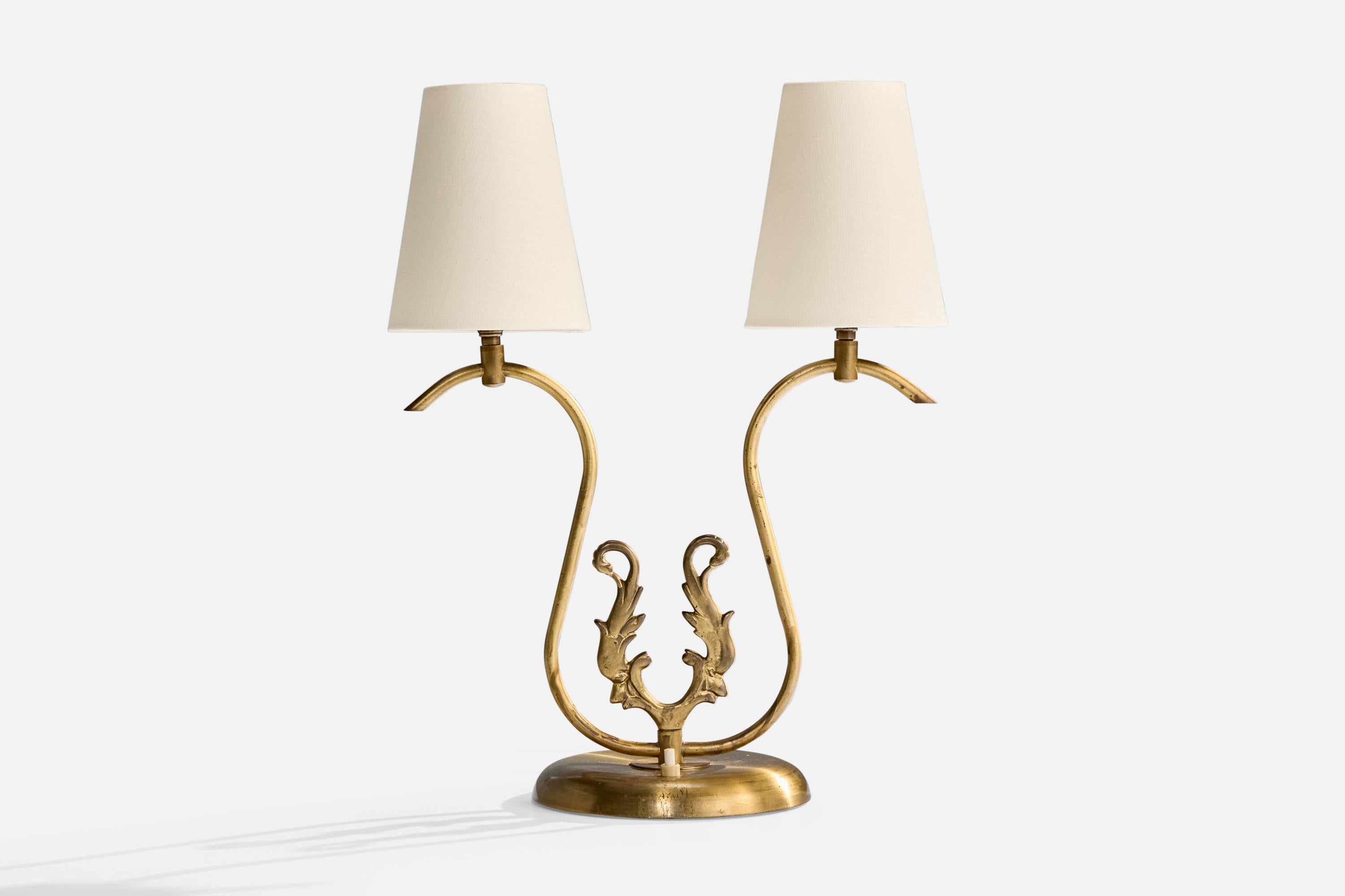 A brass and white fabric table lamp designed and produced in Sweden, c. 1940s.

Dimensions of Lamp with Shade (inches): 17.5
