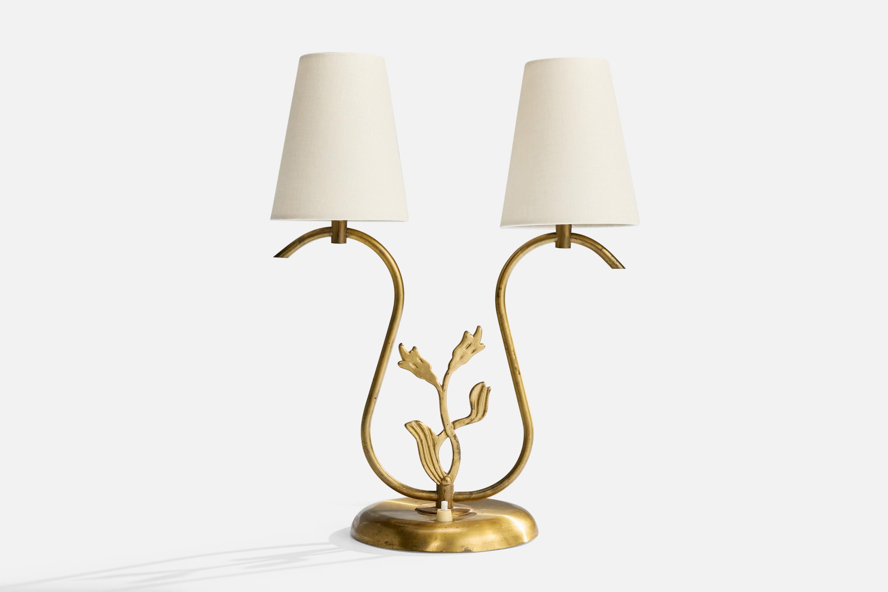 A brass and white fabric table lamp designed and produced in Sweden, c. 1940s.

Oxidation present to brass. 

Brand new fabric lampshades.

Wear consistent with age and use

Overall Dimensions (inches): 17.25
