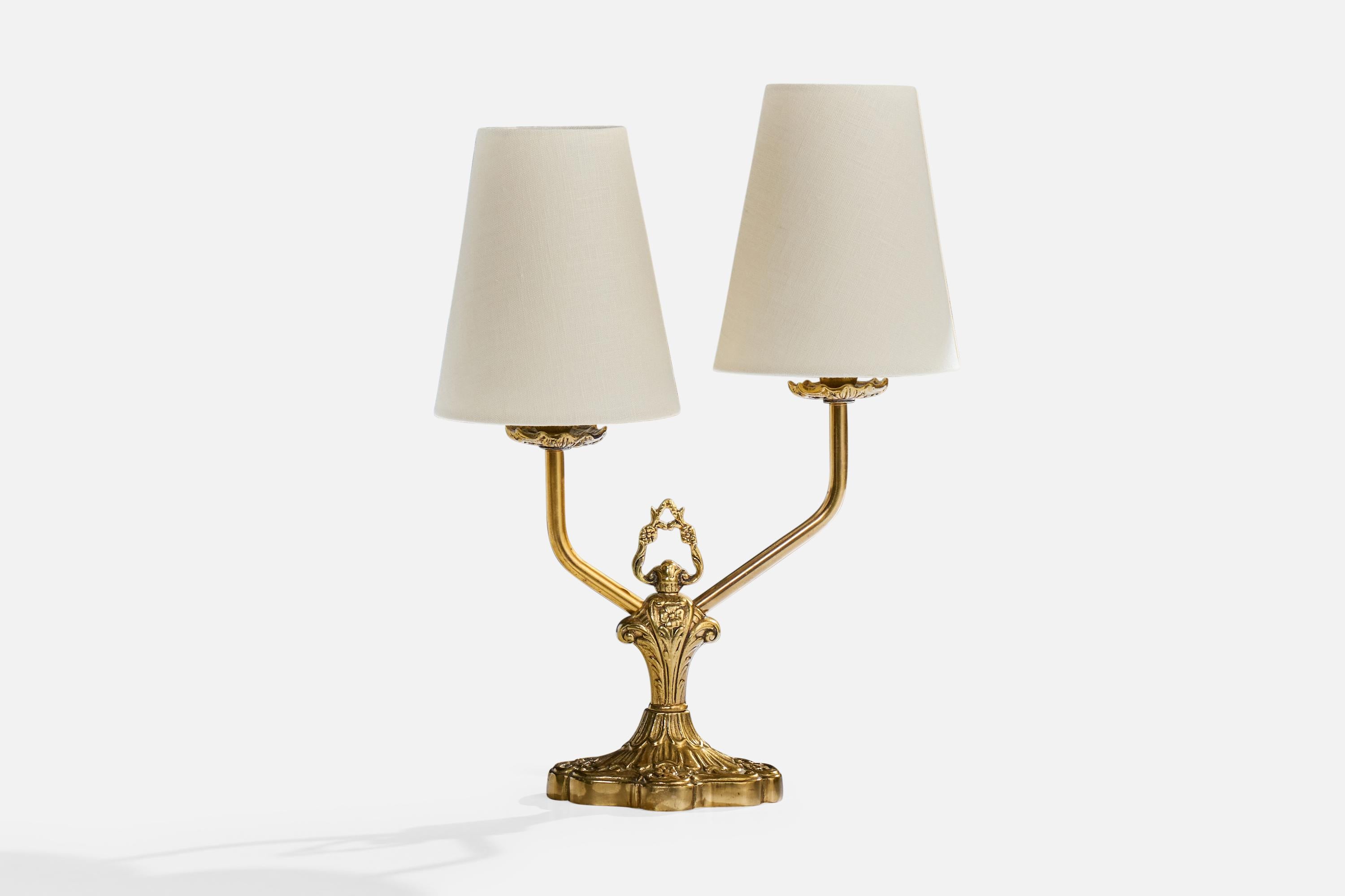 A brass and white fabric table lamp designed and produced in Sweden, c. 1940s.

Dimensions of Lamp with Shade (inches): 15.0
