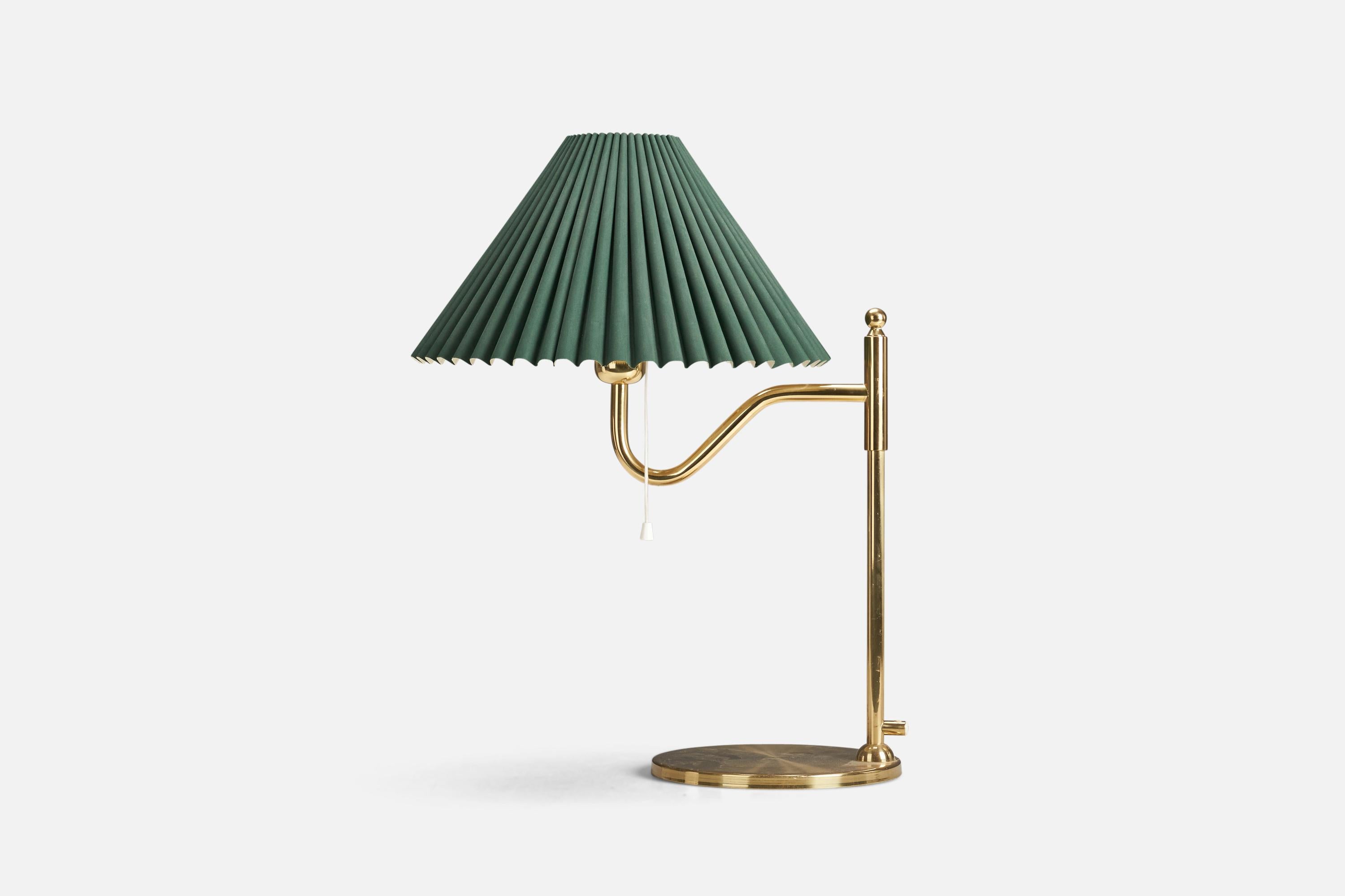 A brass and paper table lamp designed and produced by a Swedish Designer, Sweden, 1970s.

Socket takes standard E-26 medium base bulb.

The maximum wattage stated on the fixture is 60.