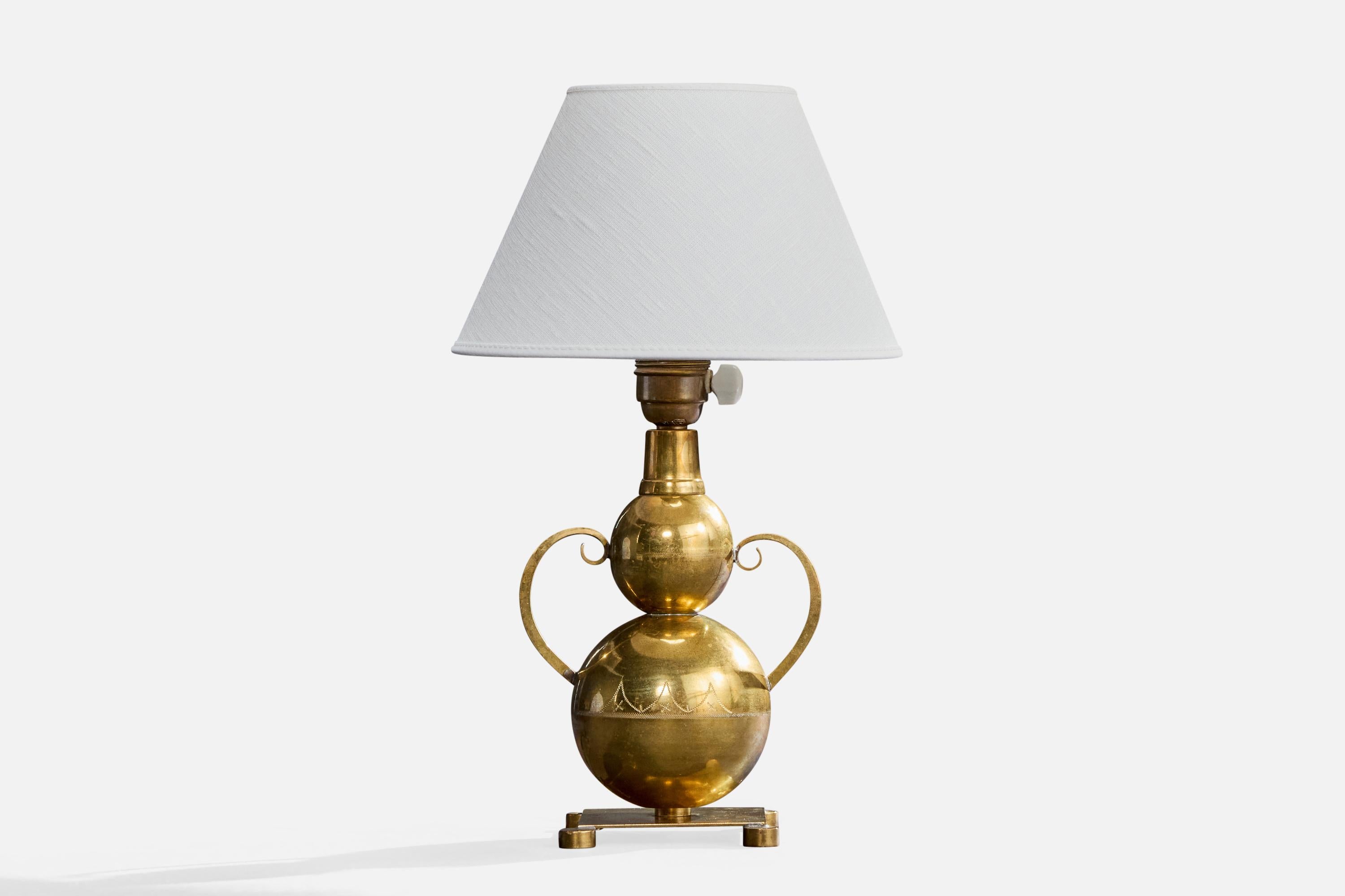 An engraved brass table lamp likely designed and produced in Sweden, c 1930s.

Dimensions of Lamp (inches): 10.7