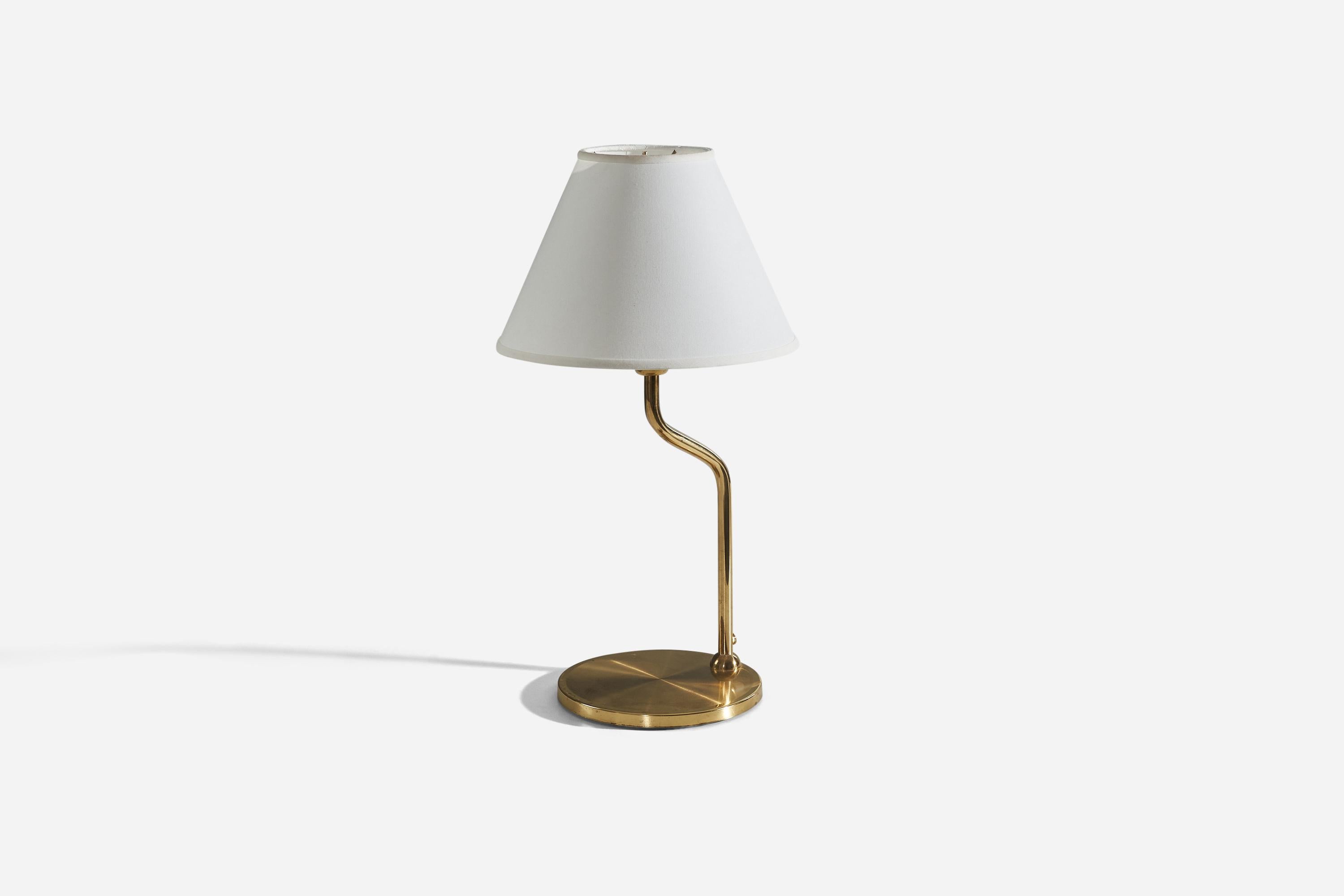A brass table lamp designed and produced in Sweden, c. 1970s.

Sold without lampshade. 
Dimensions of Lamp (inches) : 17.18 x 8.62 x 8.62 (H x W x D)
Dimensions of Shade (inches) : 5 x 12.25 x 8.75 (T x B x S)
Dimension of Lamp with Shade