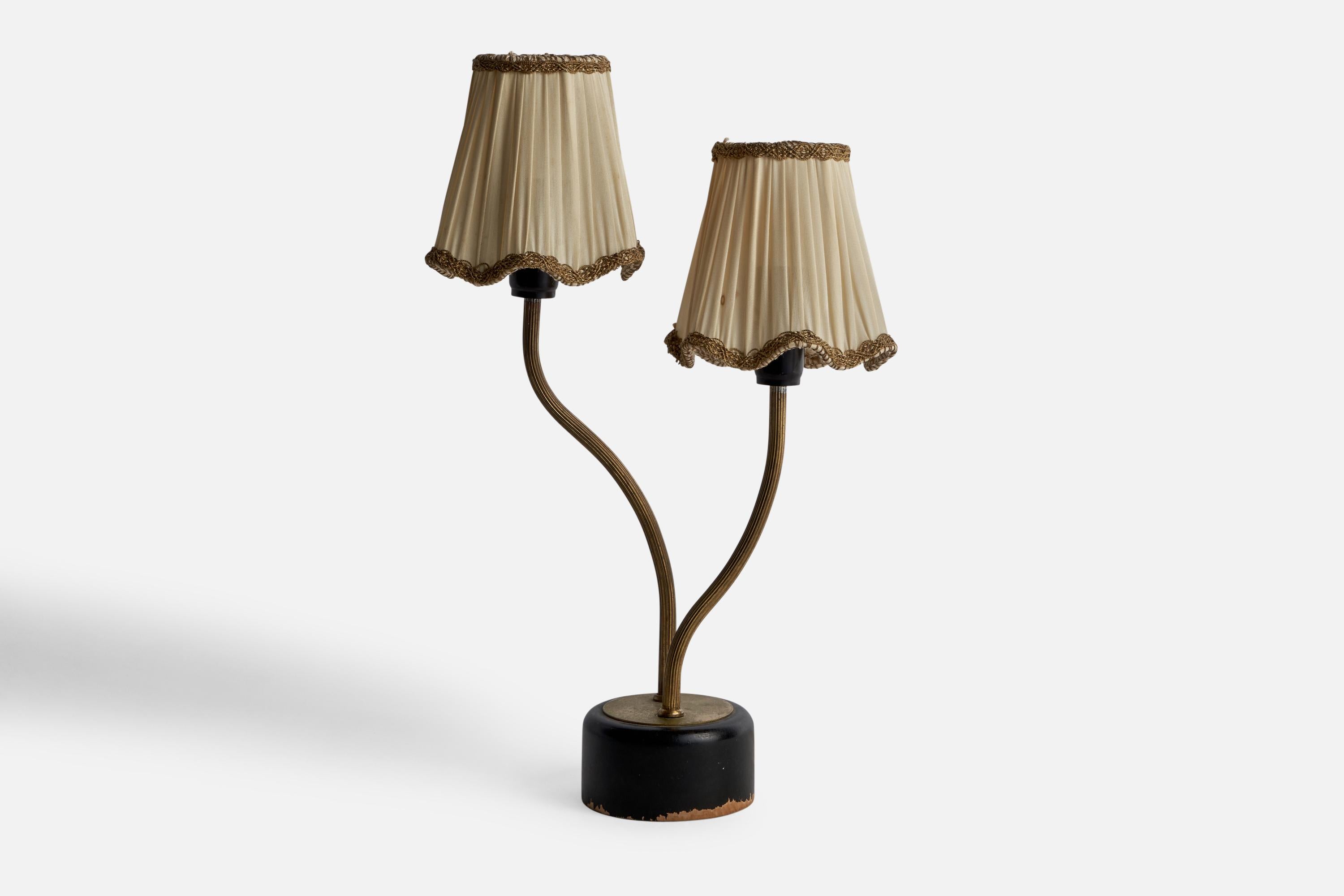 A brass, black-painted wood and beige fabric table lamp designed and produced in Sweden, c. 1940s.

Overall Dimensions (inches): 13.15” H x 8.5” W x 4.2” D
Bulb Specifications: E-14 Bulbs
Number of Sockets: 2
All lighting will be converted for US