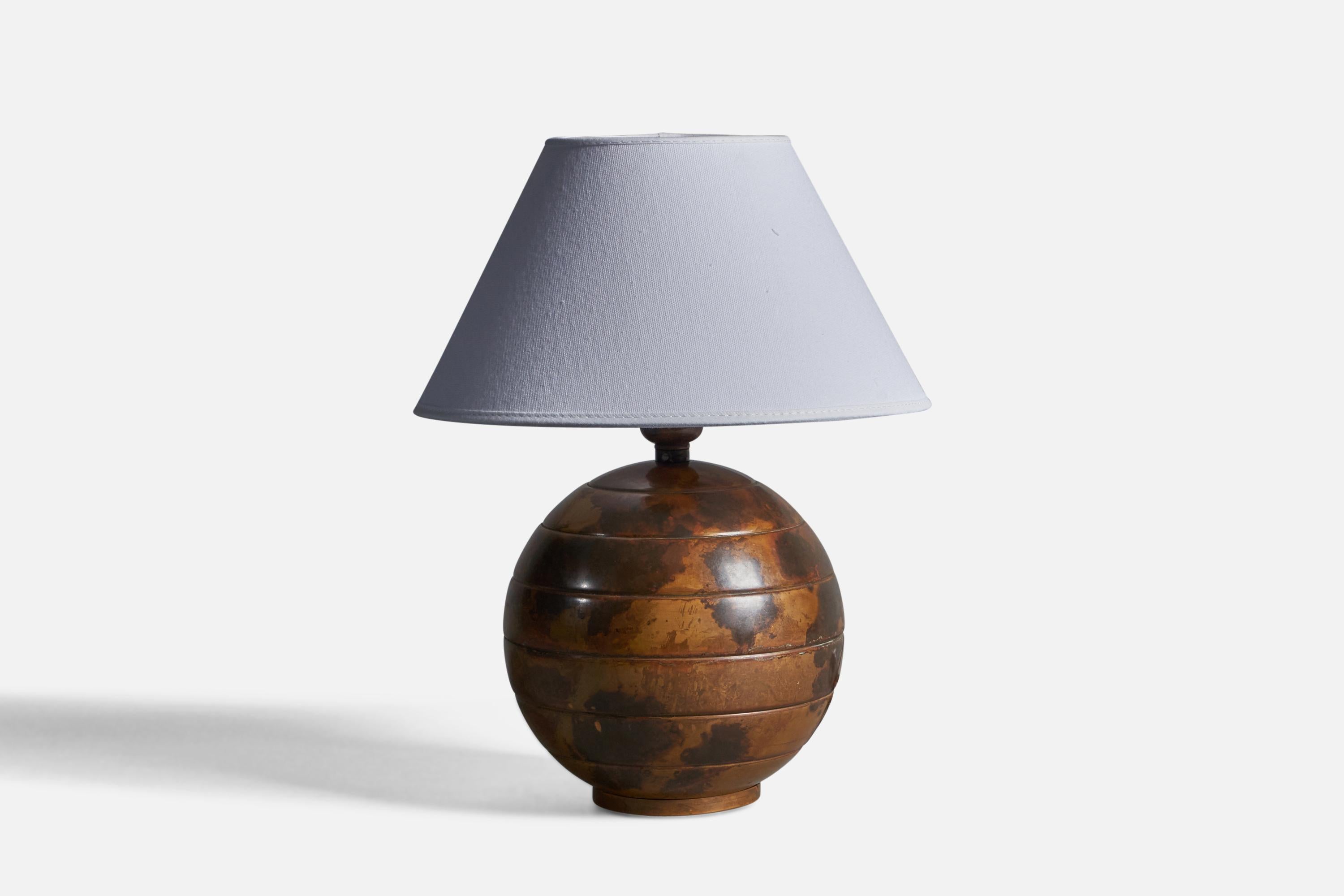 A patinated bronze table lamp, designed and produced in Sweden, c. 1930s.

Dimensions of Lamp (inches): 10.25