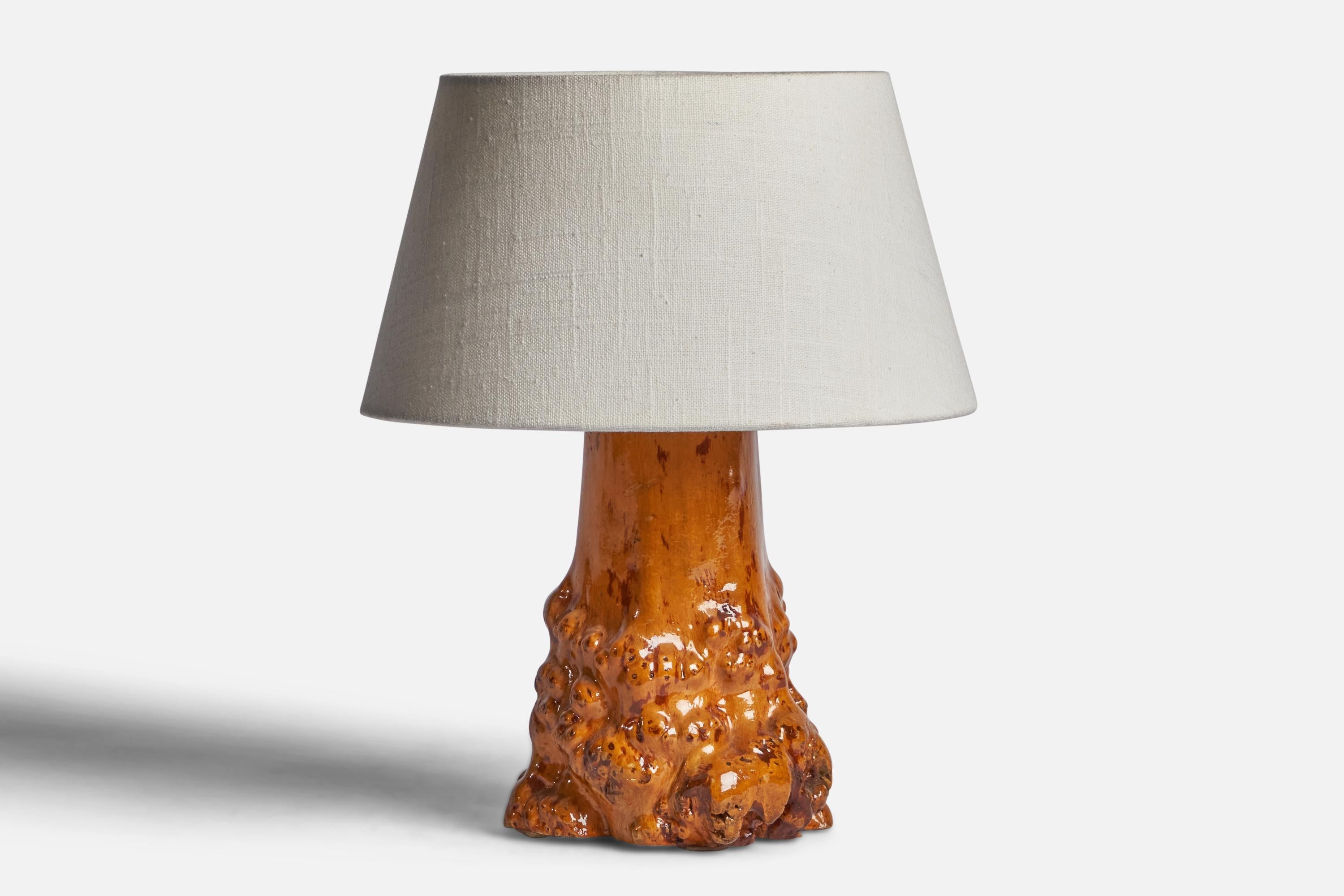 A burl wood table lamp designed and produced in Sweden, c. 1940s.

Dimensions of Lamp (inches): 9.65” H x 5.35” Diameter
Dimensions of Shade (inches): 7” Top Diameter x 10” Bottom Diameter x 5.5” H 
Dimensions of Lamp with Shade (inches): 12.5” H x