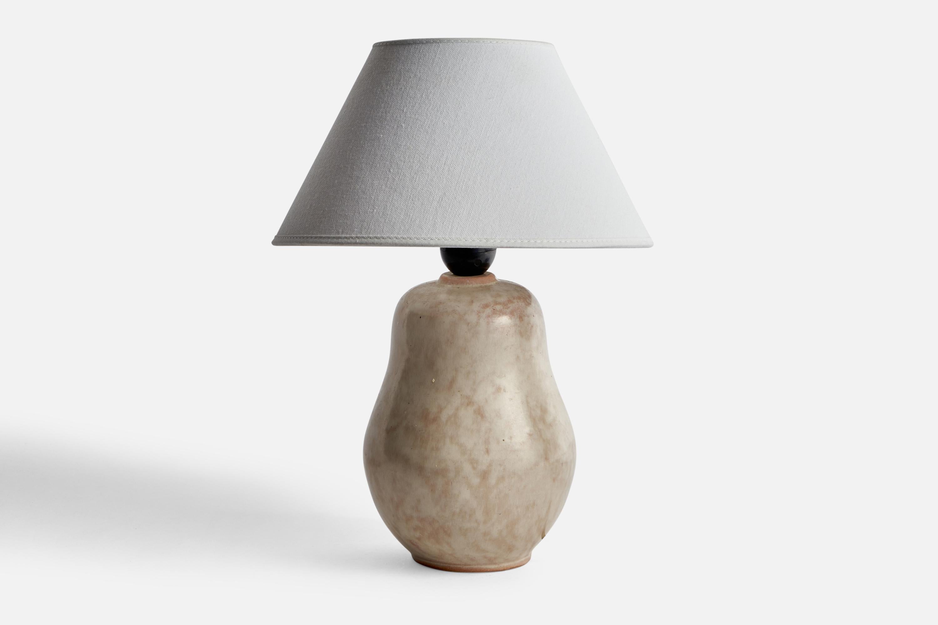 A grey-glazed ceramic table lamp designed and produced in Sweden, c. 1940s.

Dimensions of Lamp (inches): 10” H x 5.65” Diameter
Dimensions of Shade (inches): 4.5” Top Diameter x 10” Bottom Diameter x 5.25” H
Dimensions of Lamp with Shade (inches):