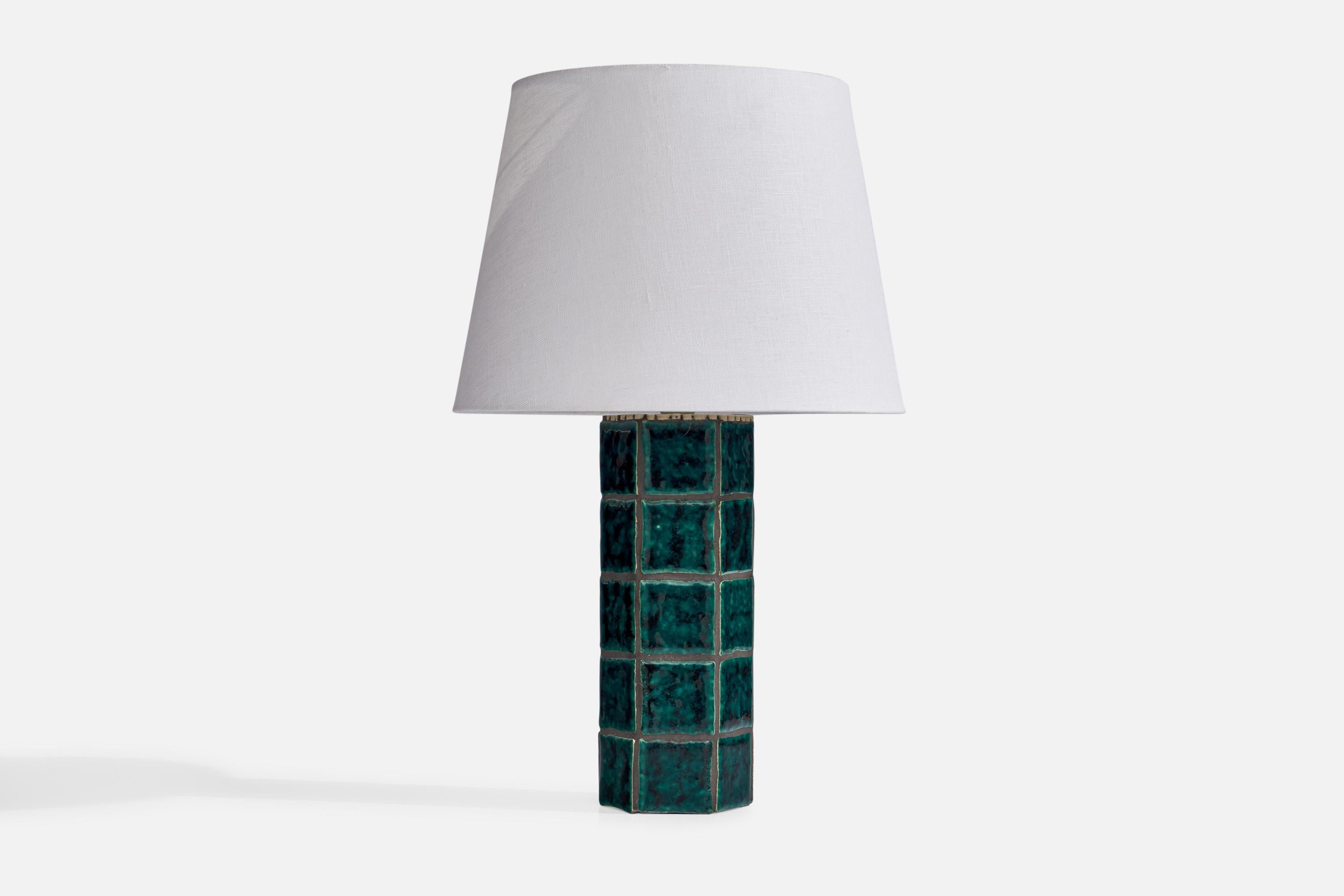 A blue-green ceramic tile table lamp designed and produced in Sweden, 1970s.

Dimensions of Lamp (inches): 13.5” H x 4.25” Diameter
Dimensions of Shade (inches): 9” Top Diameter x 12” Bottom Diameter x 9” H
Dimensions of Lamp with Shade (inches):