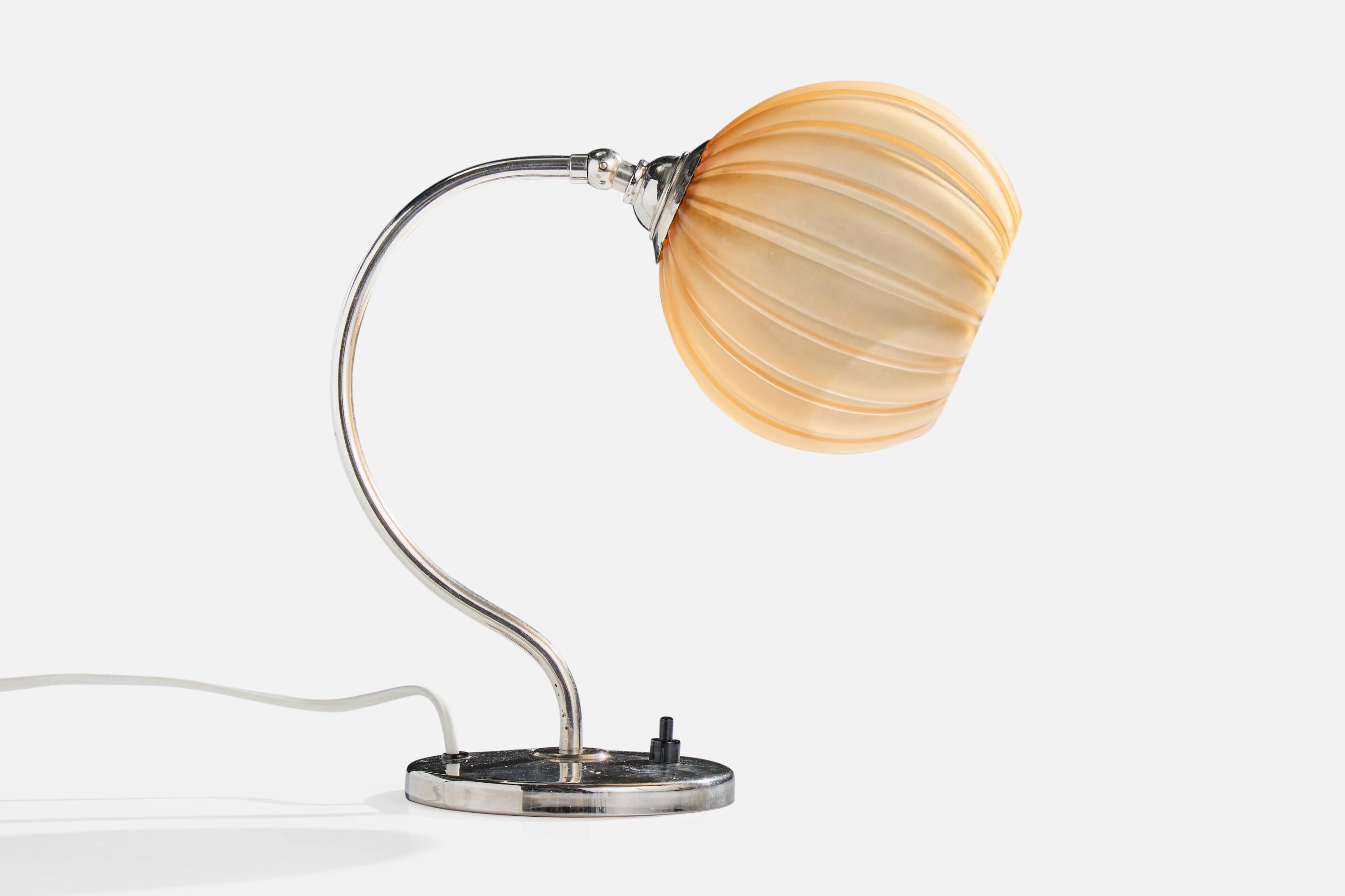 A chrome-plated metal and orange glass table lamp designed and produced in Sweden, c. 1930s.

Dimensions are variable, measured as shown.

Dimensions of Lamp (inches): 11.0