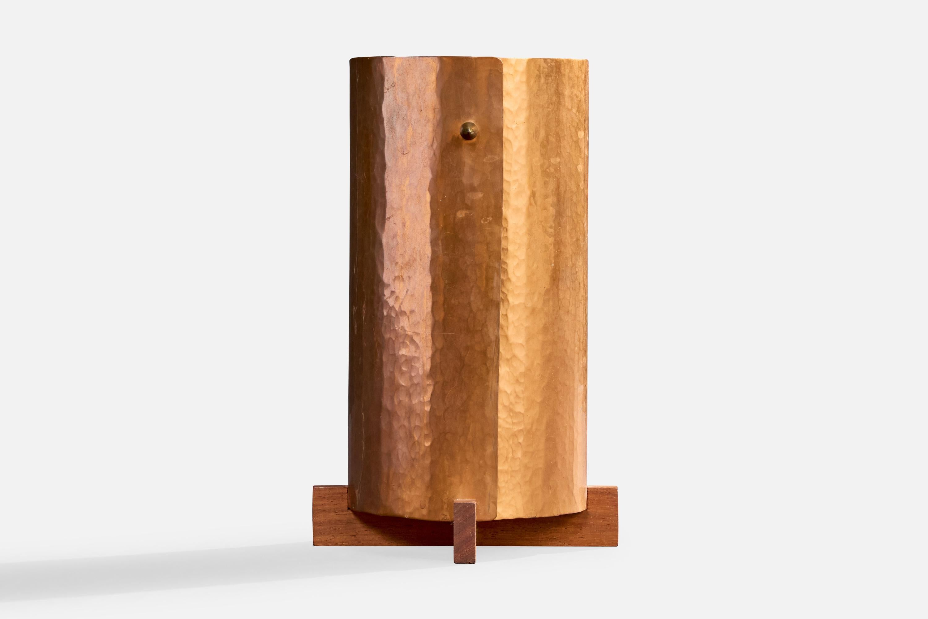 A copper, teak and brass table lamp designed and produced in Sweden, c. 1960s.

Dimensions of Lamp (inches): 10.4