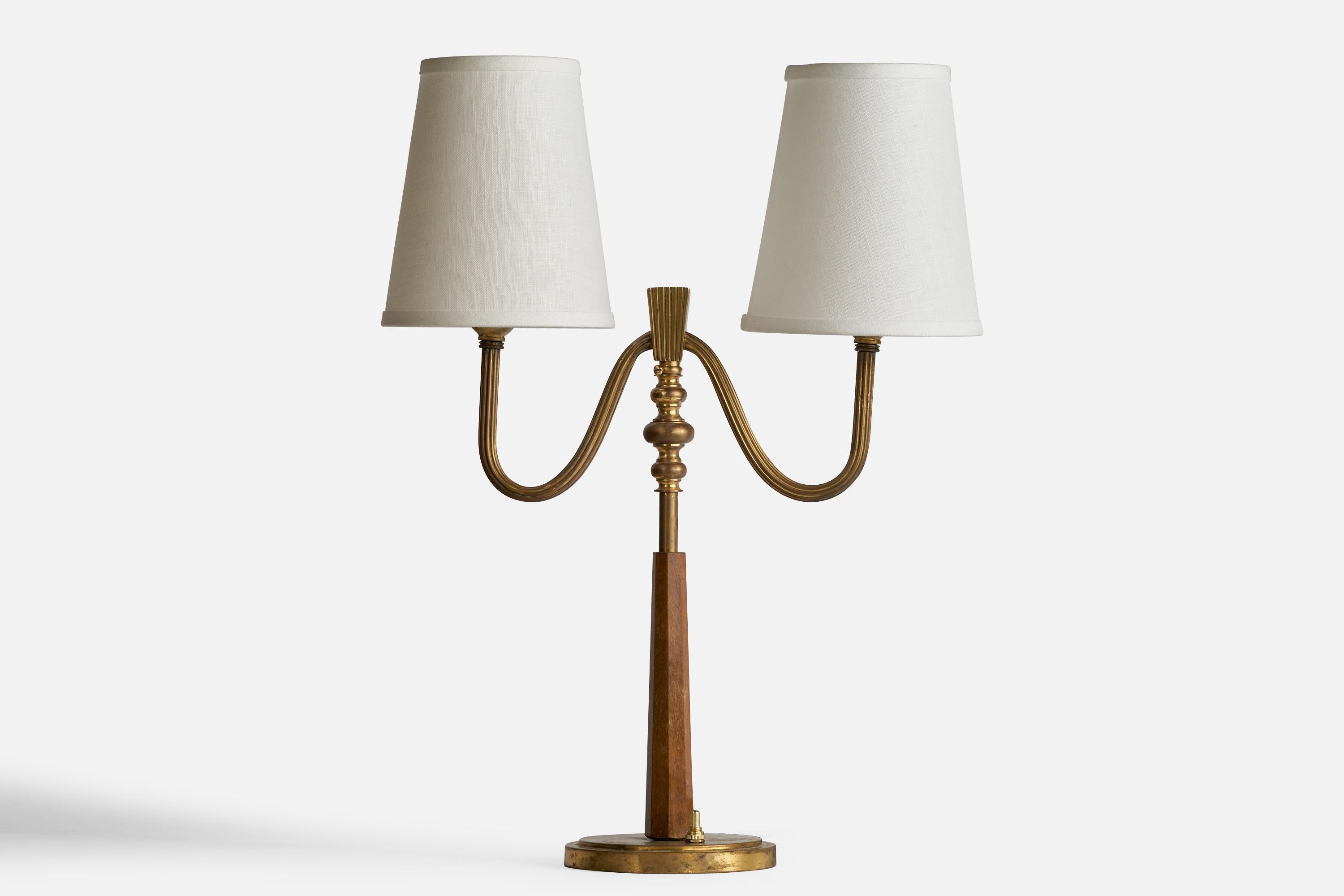 A two-armed brass, stained elm and white fabric table lamp, model 15455, designed and produced by Böhlmarks, Sweden, 1930s.

Dimensions of Lamp (inches): 16” H x 5.5” Diameter
Dimensions of Shade (inches): 4”  Top Diameter x 6” Bottom Diameter x 7”