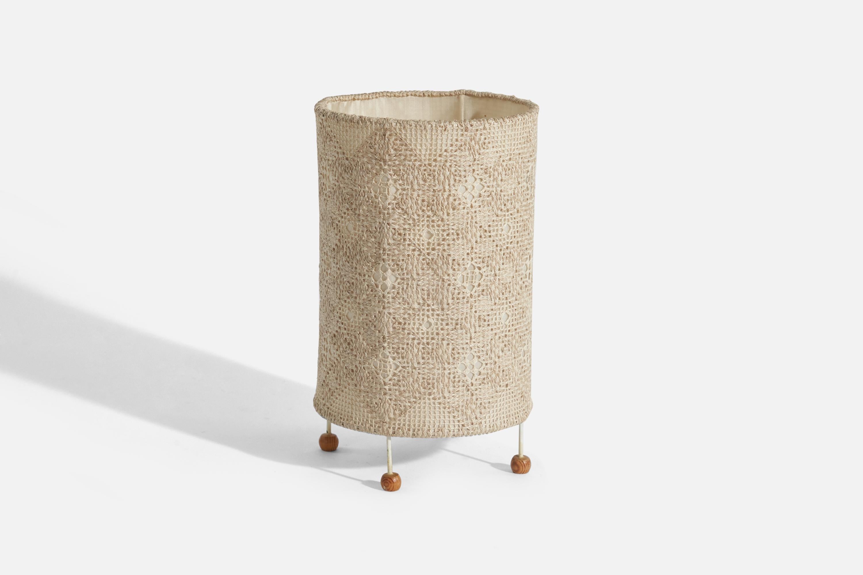 A white-lacquered metal, pine and embroidered fabric table lamp designed and produced in Sweden, c. 1950s. 

Socket takes standard E-26 medium base bulb.
There is no maximum wattage stated on the fixture.