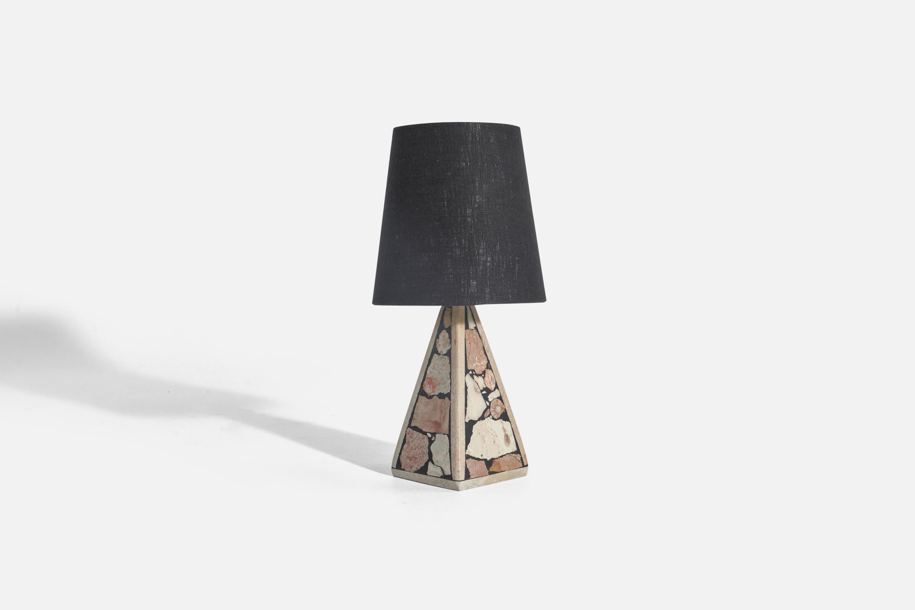 A solid stone table lamp with fossil pieces, Pietra Dura technique, designed and produced in Sweden, c. 1970s.

Sold with fabric Lampshade. 
Stated dimensions refer to the Lamp with the Shade. 

Socket takes standard E-26 medium base bulb.
There is
