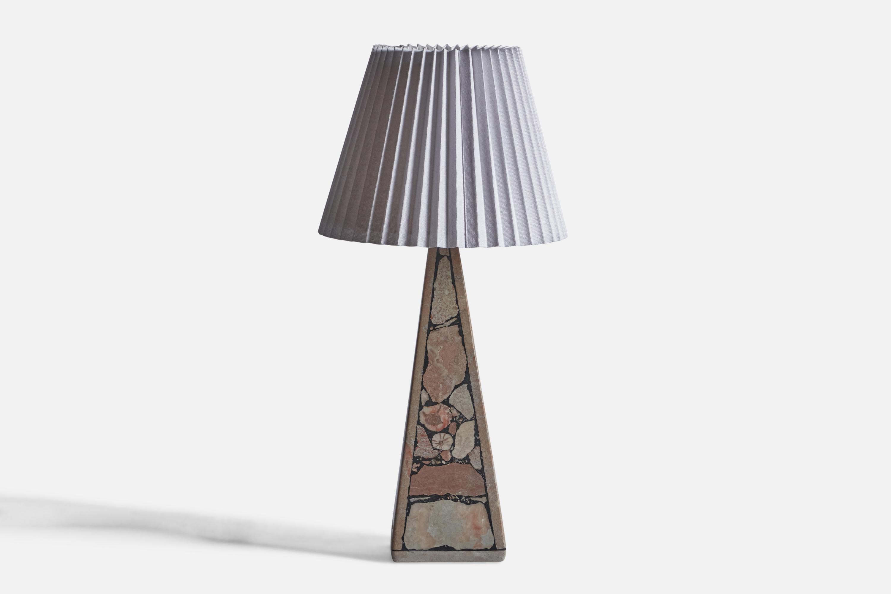A fossil stone and paper table lamp, designed and produced in Gotland, Sweden, c. 1970s.

Sold with Lampshade. Dimensions stated are of table Lamp with Lampshade.
