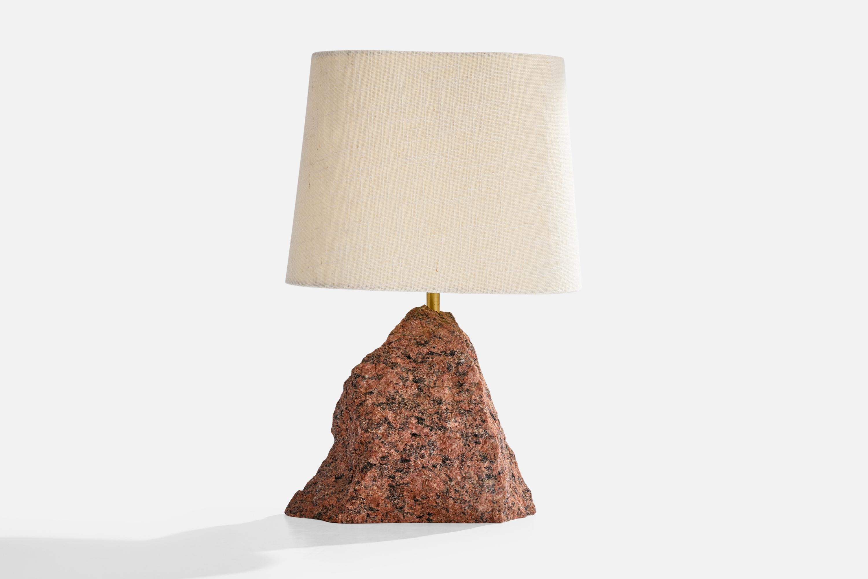 A red granite, brass and off-white fabric table lamp designed and produced in Sweden, c. 1980s.

Dimensions of Lamp with Shade (inches): 16.65