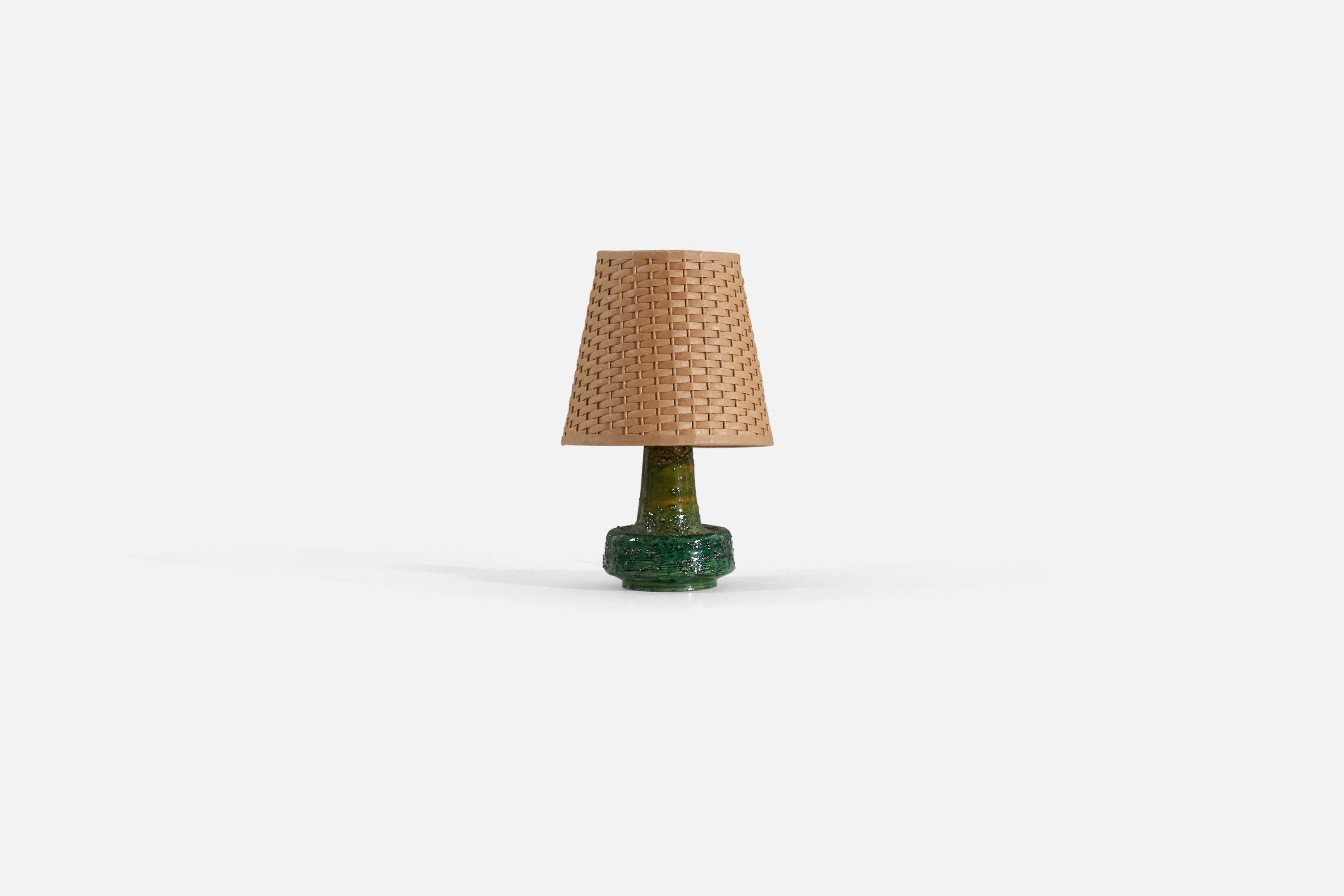 A green-glazed stoneware table lamp designed and produced in Sweden, 1960s.

Measurements listed are of lamp without lampshade. Upon request illustrated model lampshade can be included in purchase.

Shade : 4.25 x 6.25 x 6
Lamp with shade : 10
