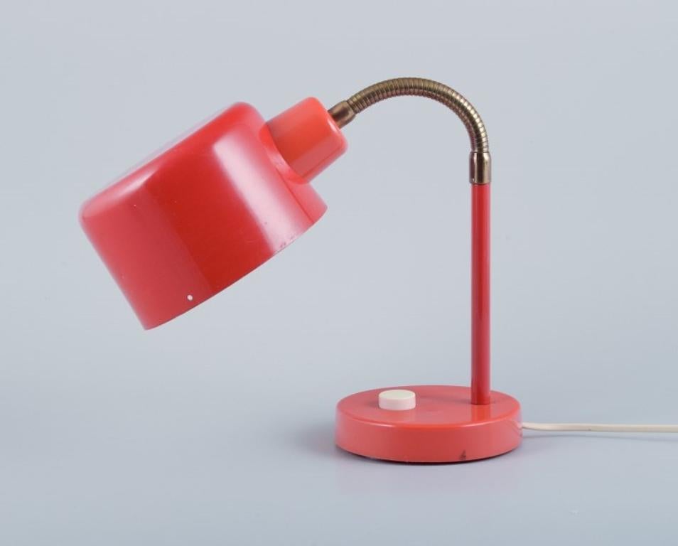 Swedish designer, table lamp in retro style. Orange lacquer.
Approximately 1970.
Adjustable.
In excellent condition.
Dimensions:
Cord length: 194 cm.
Height with lampshade pointing downwards: 30.0 cm.
Width: 30.0 cm.