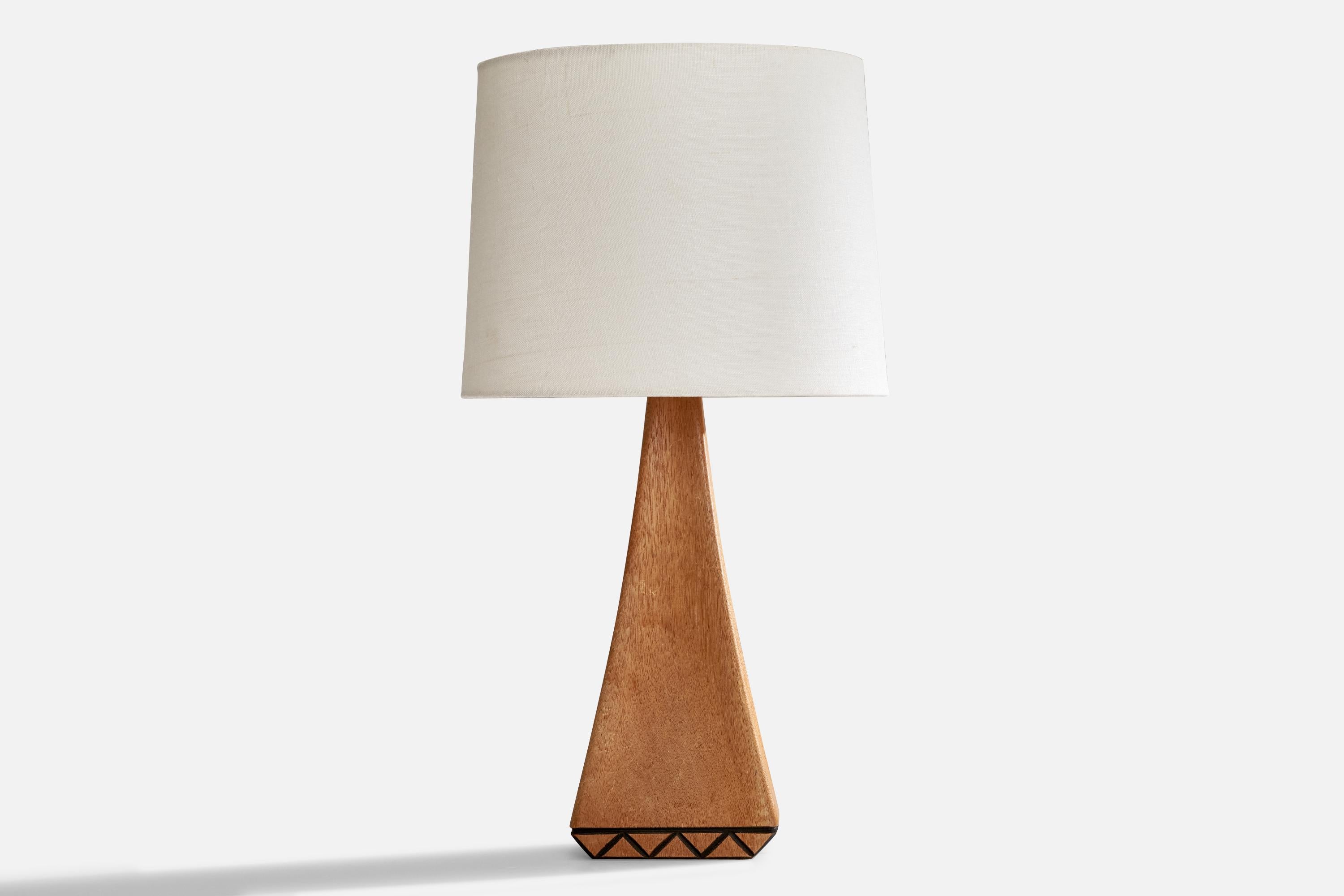 A solid oak table lamp designed and produced in Sweden, c. 1970s.

Dimensions of Lamp (inches): 13.75” H x 4.5” W x 3” D
Dimensions of Shade (inches): 9.125” Top Diameter x 10” Bottom Diameter x 7.875” H
Dimensions of Lamp with Shade (inches):