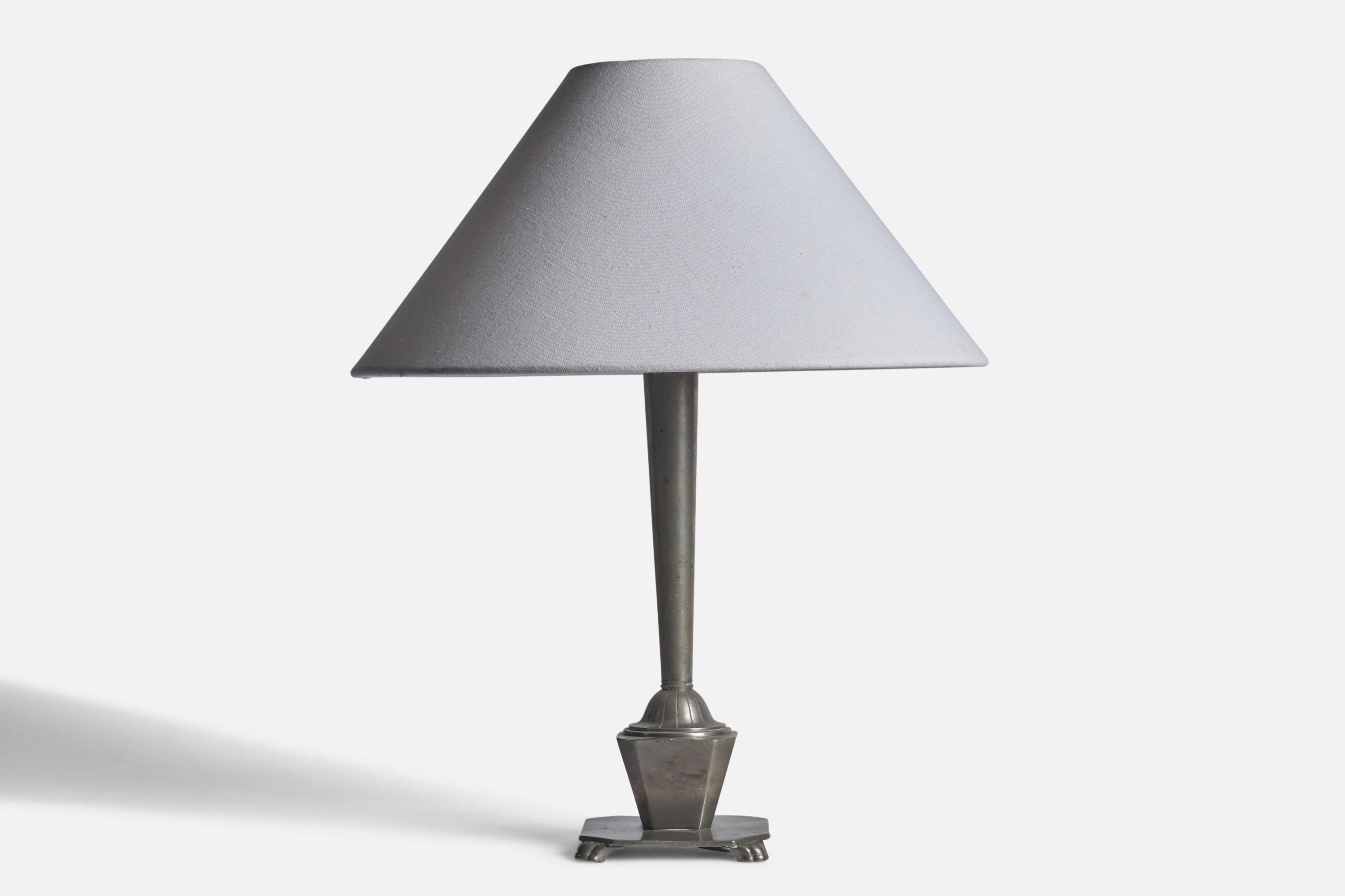 A pewter table lamp designed and produced in Sweden, 1930s.

Dimensions of Lamp (inches): 15” H x 4.75” W x 4.75” D
Dimensions of Shade (inches): 4.5” Top Diameter x 15.75” Bottom Diameter x 9.25” H 
Dimensions of Lamp with Shade (inches): 19.5” H x
