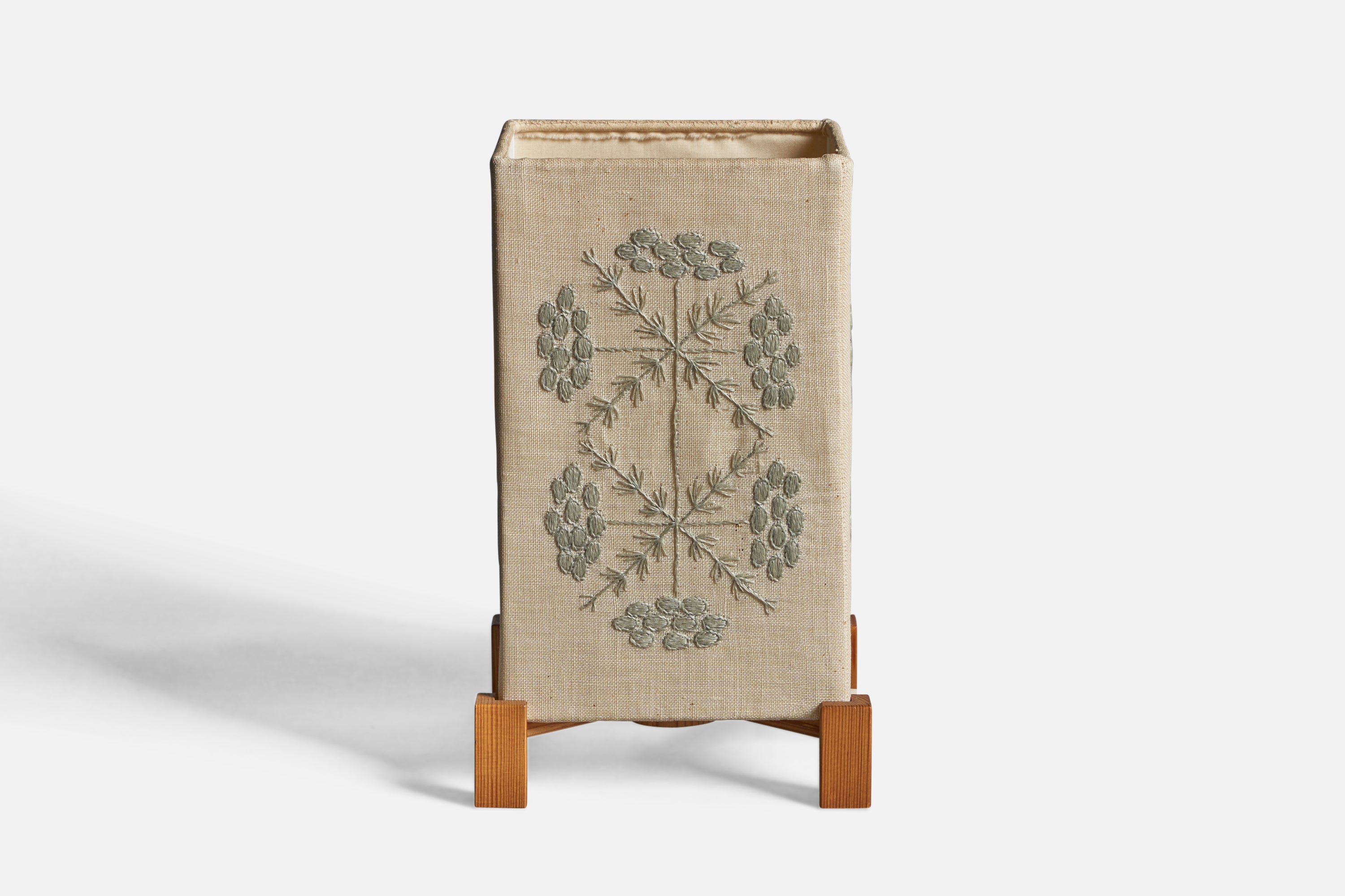 A pine and embroidery fabric table lamp, designed and produced in Sweden, c. 1960s.

Overall Dimensions (inches): 10.15