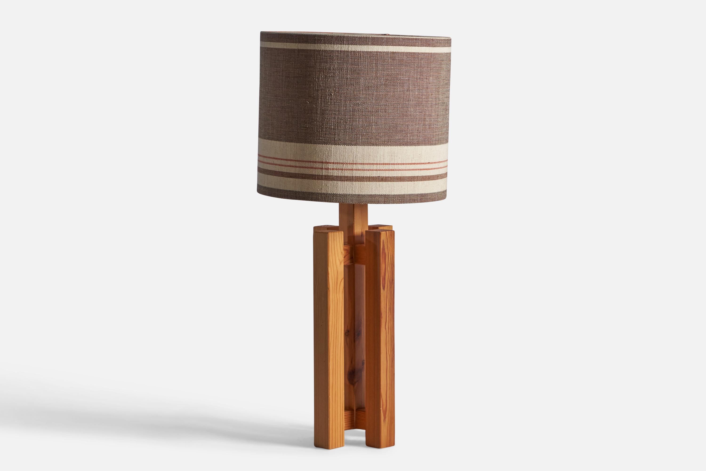 A solid pine and fabric table lamp, designed and produced in Sweden, c. 1970s.

Overall Dimensions: 22.25