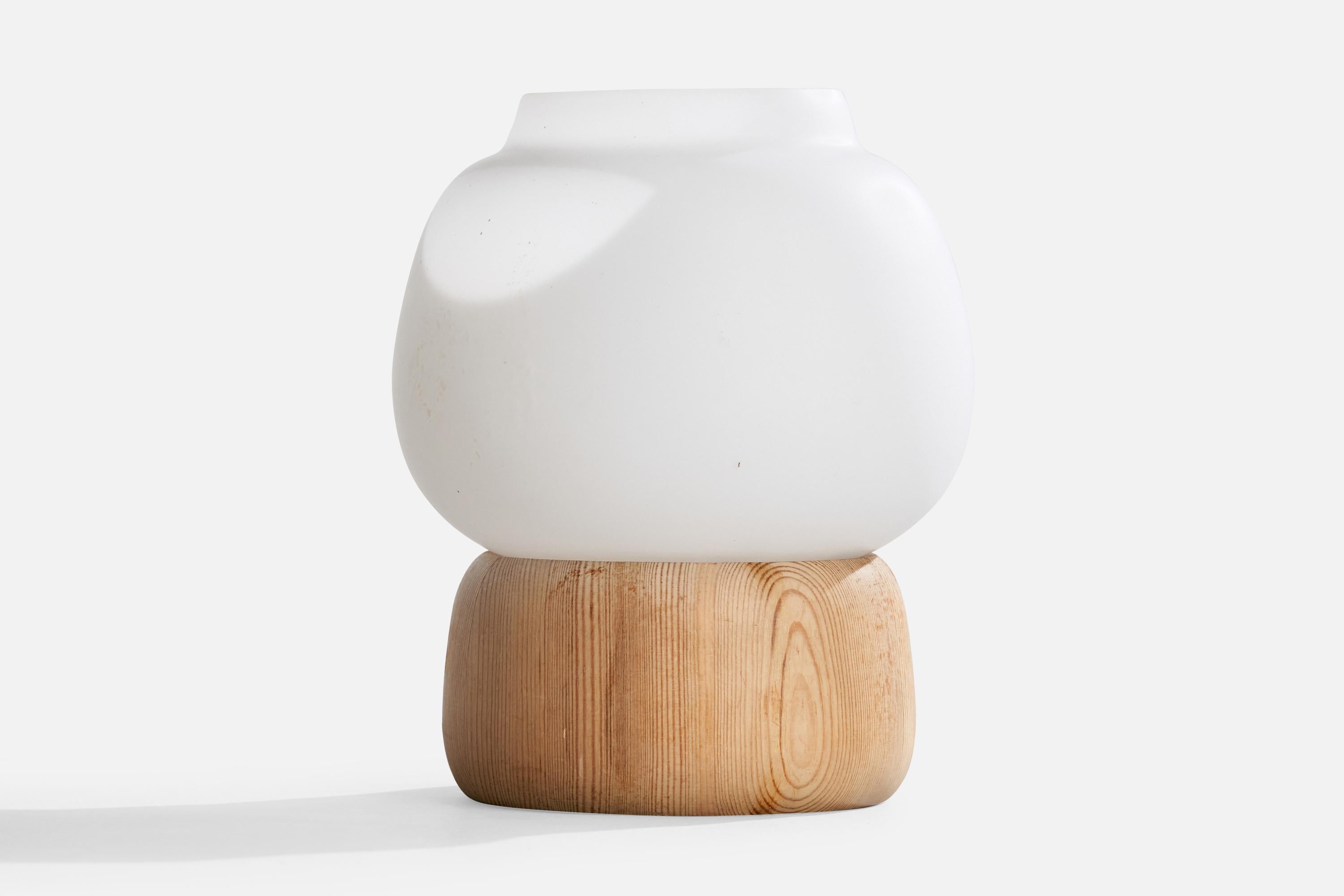 A pine and white opaline glass table lamp designed and produced in Sweden, c. 1970s.

Dimensions of Lamp with Shade (inches): 8.2“ H x 6.75“ Diameter

Bulb Specifications: E-14

Number of Sockets (per fixture): 1

Sold with lampshade.

All lighting