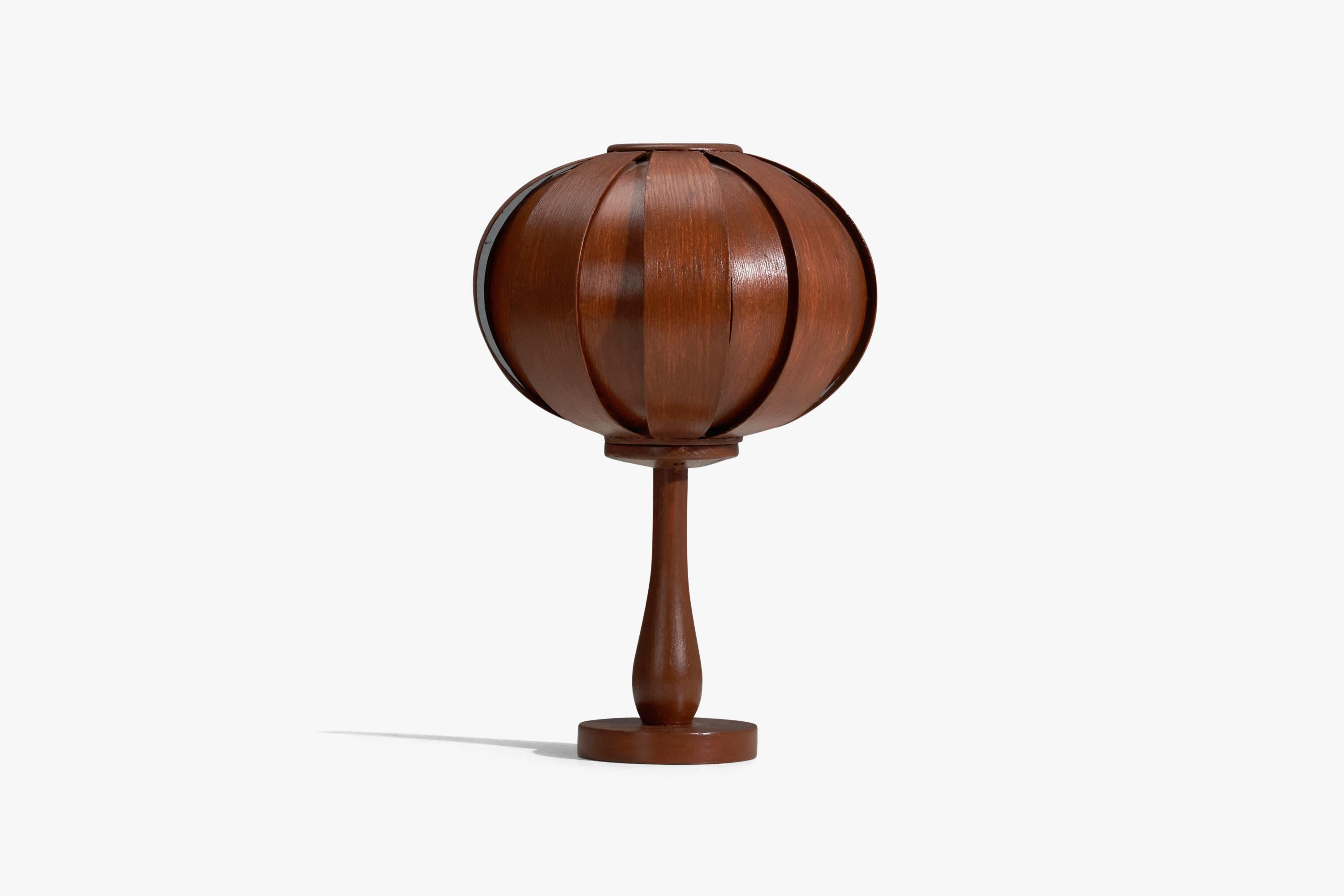 A partly brown-painted pine and moulded pine veneer table lamp designed and produced in Sweden, 1970s. 

Socket takes E-14 bulb.

There is no maximum wattage stated on the fixture.
