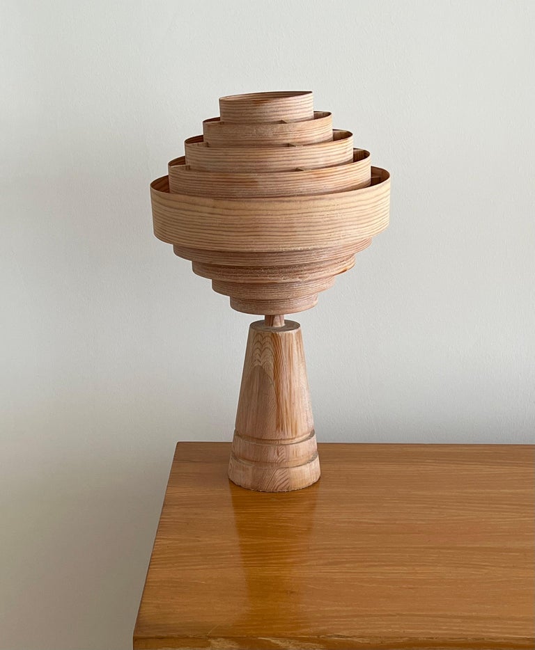 A pine table lamp designed and produced in Sweden, c. 1970s.

Sold without lampshade. 
Dimensions of lamp (inches) : 16.5 x 5.25 x 5.25 (H x W x D)
Dimensions of shade (inches) : 9 x 12 x 9 (T x B x S)
Dimension of lamp with Shade (inches) :