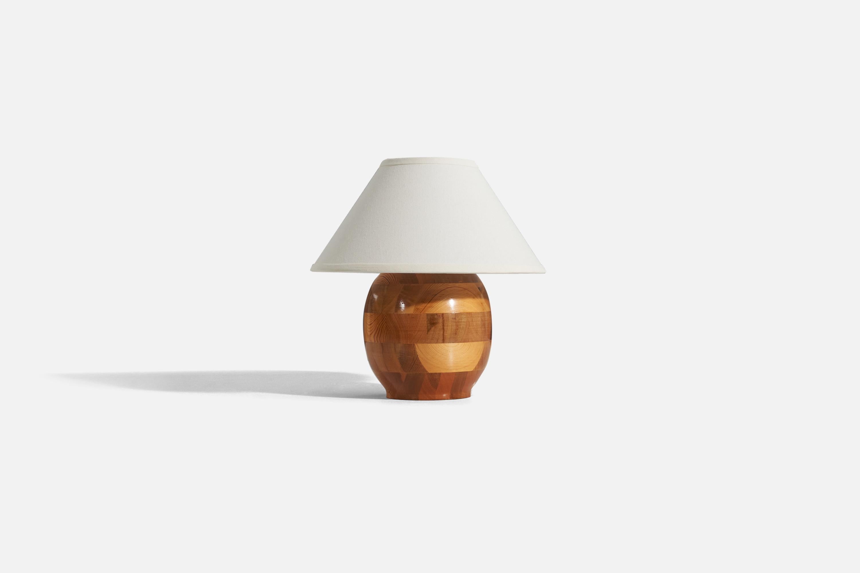 A pine table lamp designed and produced by a Swedish designer, Sweden, 1960s.

Sold without lampshade. 
Dimensions of lamp (inches) : 10.75 x 7.25 x 7.25 (H x W x D)
Dimensions of shade (inches) : 5.75 x 14 x 8 (T x B x H)
Dimension of lamp
