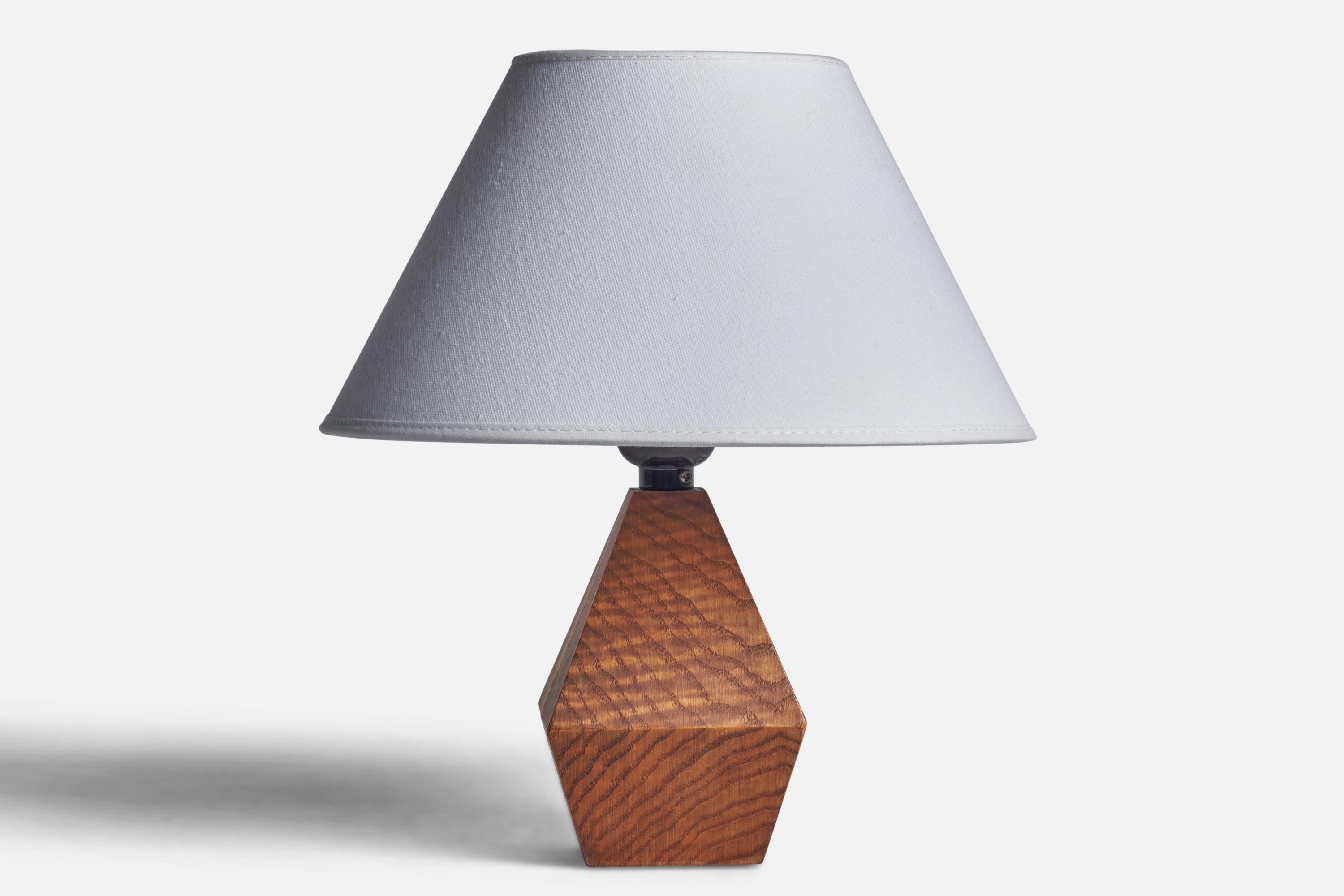 A pine table lamp designed and produced in Sweden, 1960s.

Dimensions of Lamp (inches): 8” H x 3.5” Diameter
Dimensions of Shade (inches): 7” Top Diameter x 10” Bottom Diameter x 5.5” H 
Dimensions of Lamp with Shade (inches): 11.25” H x