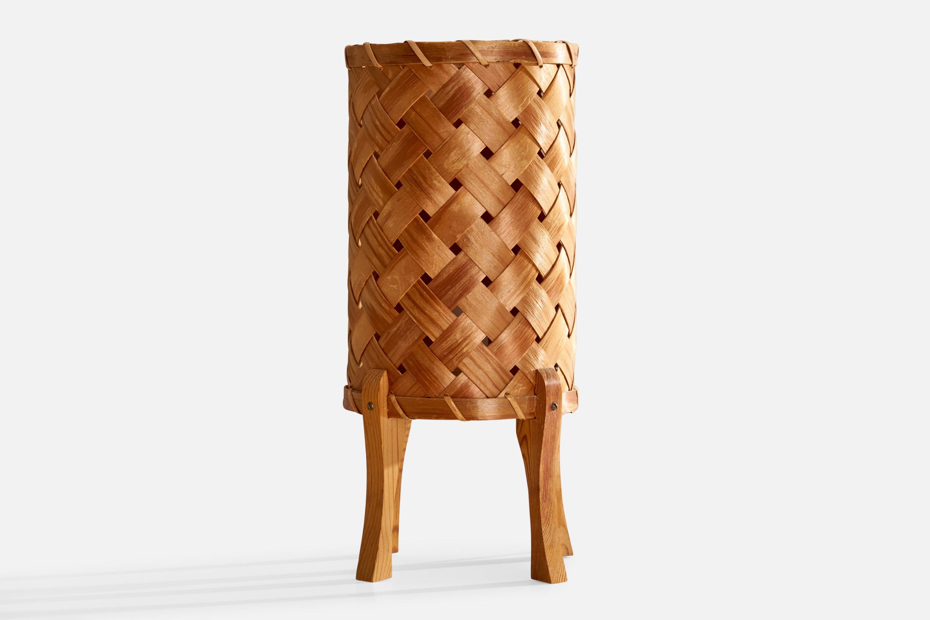 A pine and interwoven pine veneer table lamp designed and produced in Sweden, c. 1960s.

Dimensions of Lamp (inches): 11.875” H x 5.125” W x 5.5” D

Bulb Specifications: E-14

Number of Sockets (per fixture): 1

Sold with lampshade.

All lighting