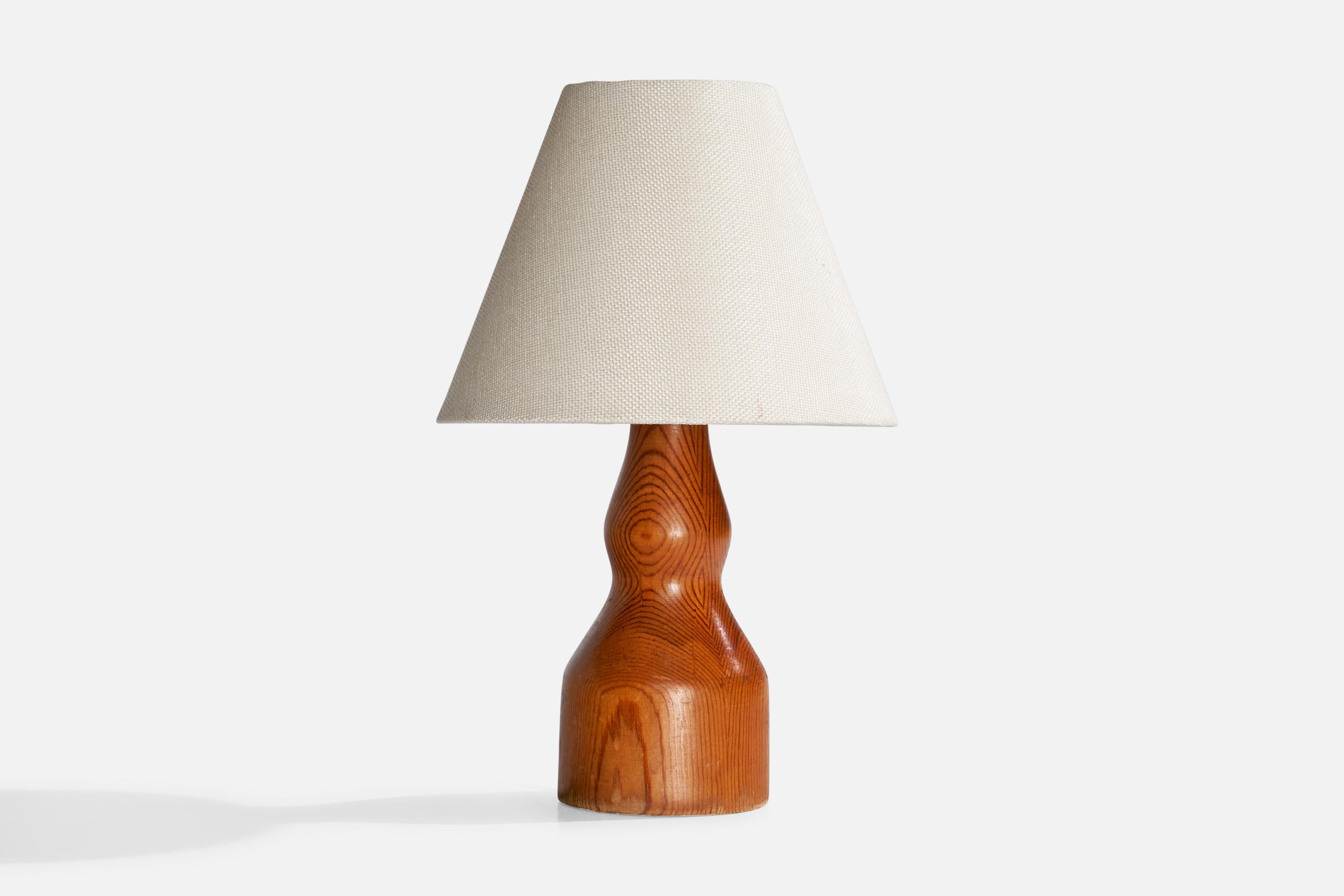 A pine table lamp designed and produced in Sweden, dated 1962.

Dimensions of Lamp (inches):  9.125“ H x 3.625” diameter

Dimensions of Shade (inches):  3.75“ Top Diameter x  8” Bottom Diameter x  6.25“ H

Dimensions of Lamp with Shade (inches):