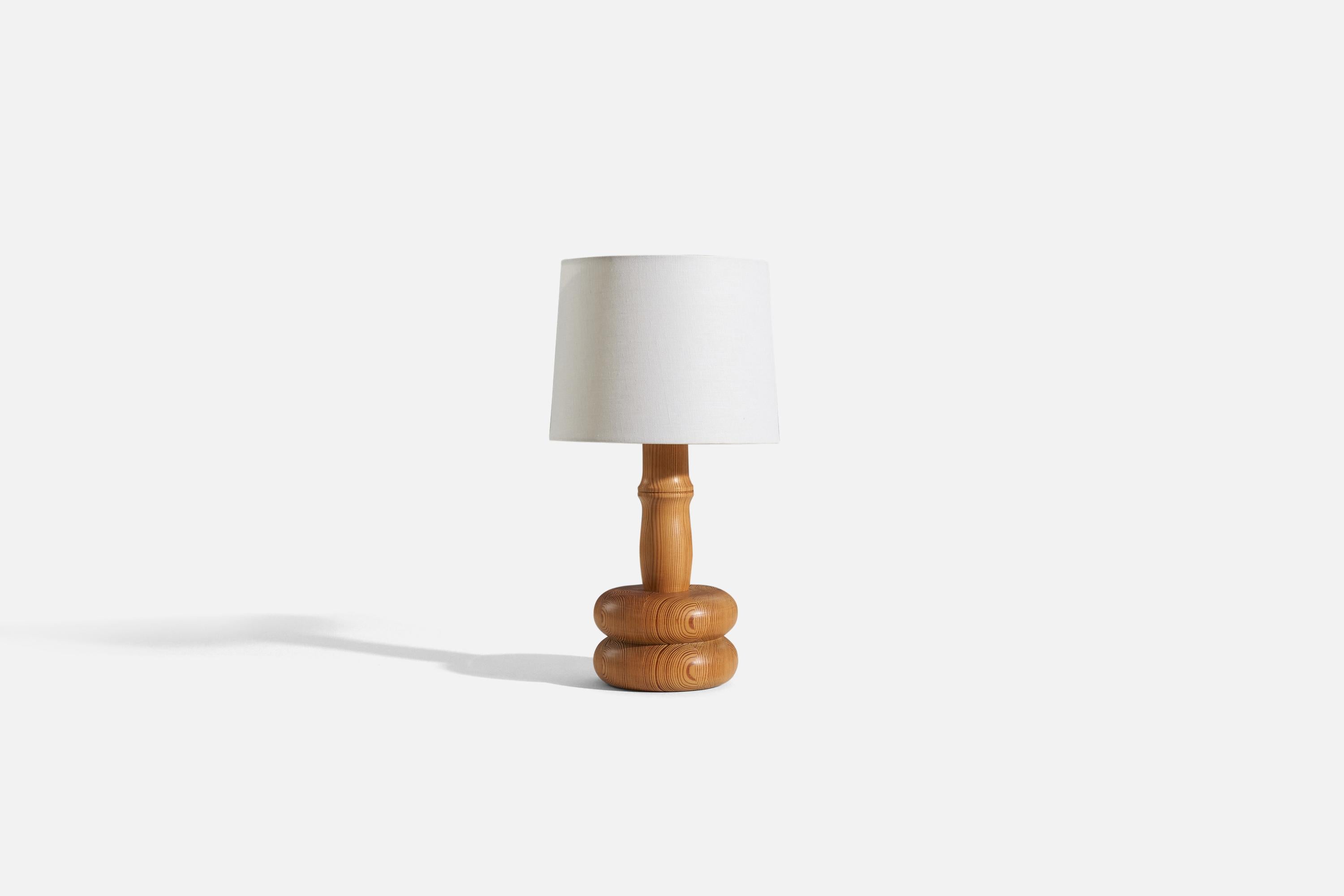 A pine table lamp designed and produced by a Swedish designer, Sweden, 1970s.

Sold without lampshade. 
Dimensions of Lamp (inches) : 15.375 x 6.25 x 6.25 (H x W x D)
Dimensions of Shade (inches) : 9.125 x 10 x 7.875 (T x B x H)
Dimension of