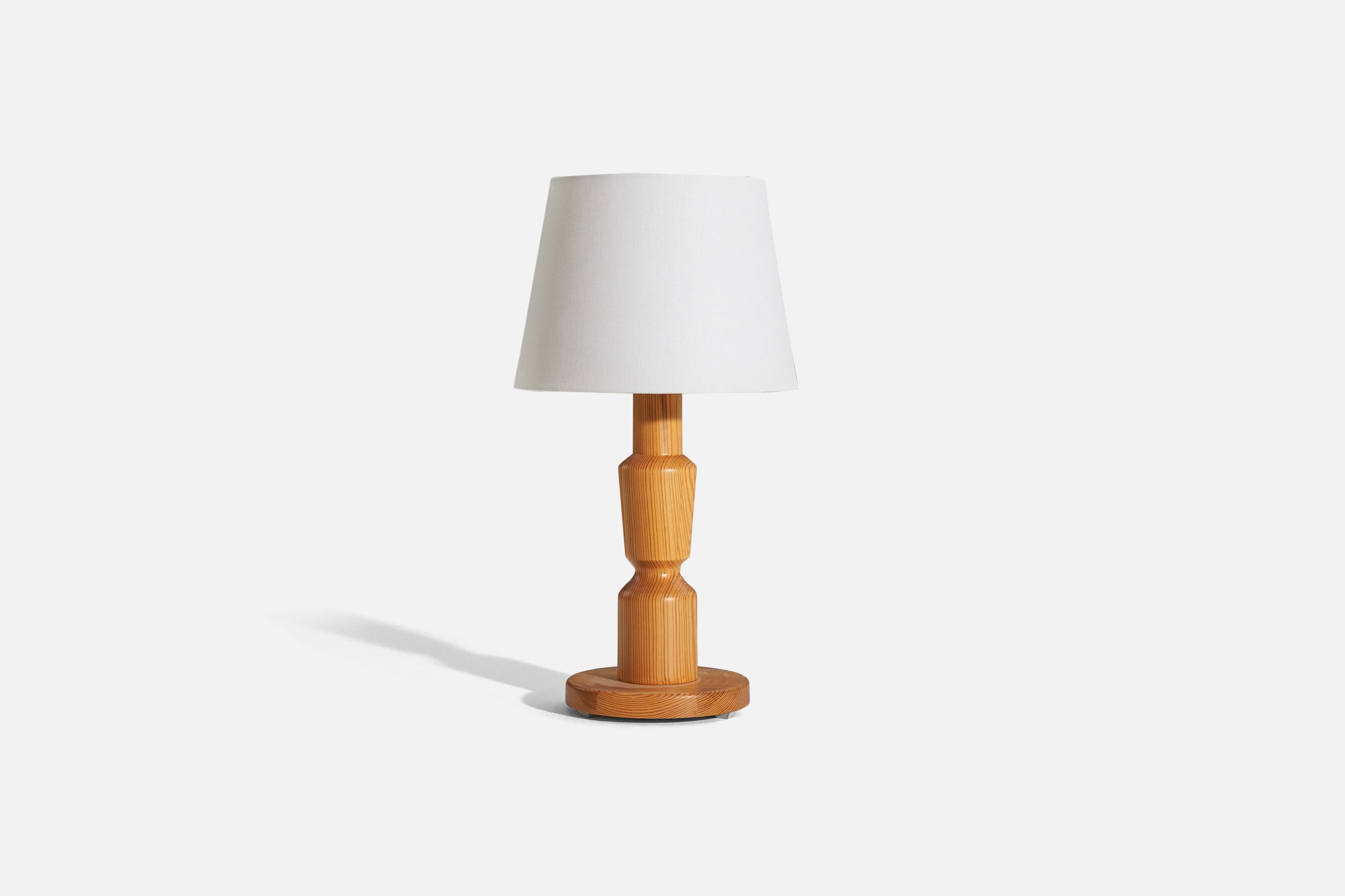 A solid pine table lamp designed and produced by a Swedish designer, Sweden, 1970s.

Sold without lampshade. 
Dimensions of lamp (inches) : 17.25 x 7.875 x 7.875 (H x W x D)
Dimensions of shade (inches) : 9 x 12 x 9 (T x B x H)
Dimension of