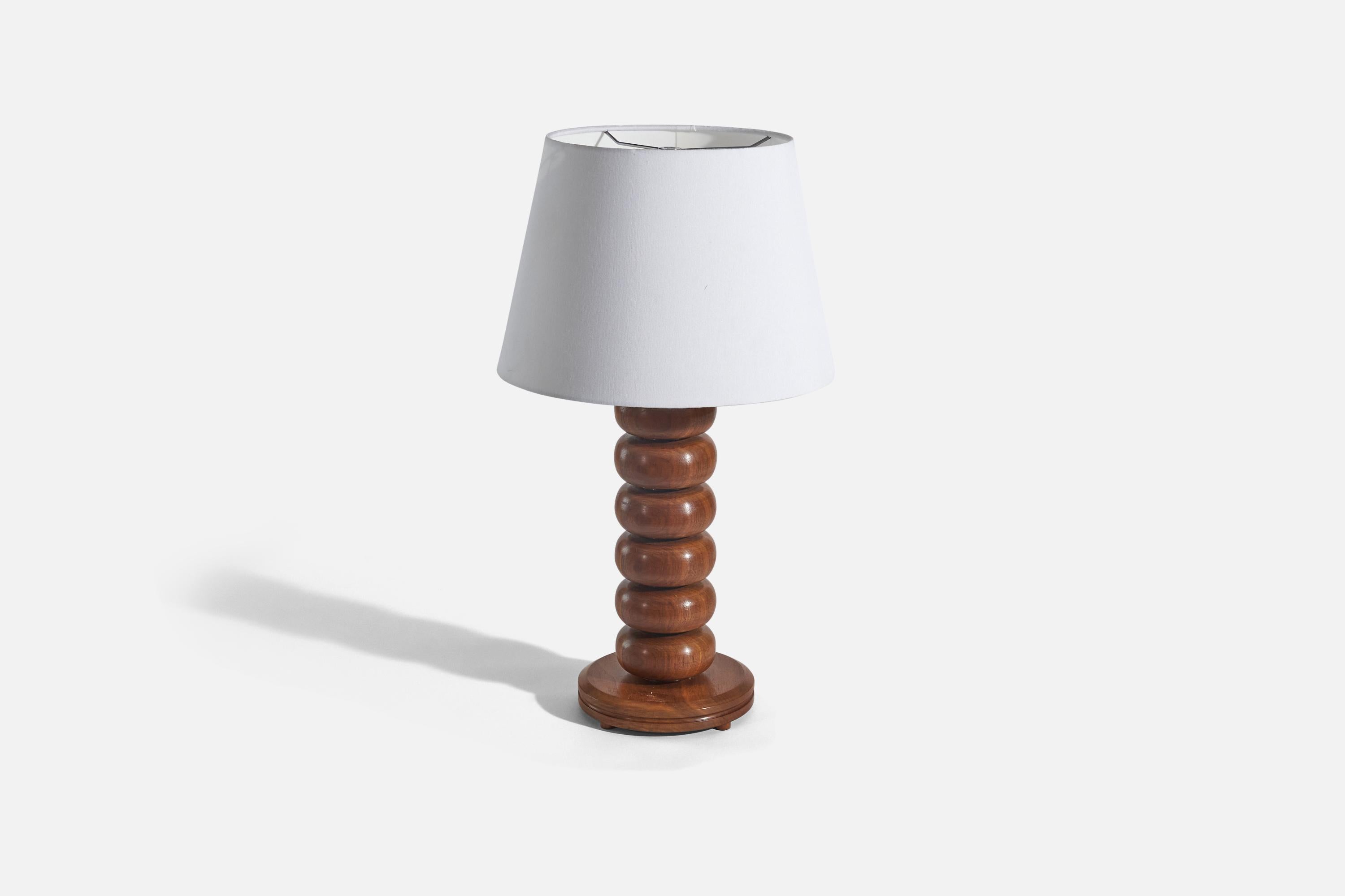 A pine table lamp designed and produced in Sweden, 1970s.

Sold without lampshade. 
Dimensions of Lamp (inches) : 17.68 x 7.62 x 7.62 (Height x Width x Depth)
Dimensions of Shade (inches) : 10 x 14.12 x 10 (Top Diameter x Bottom Diameter x