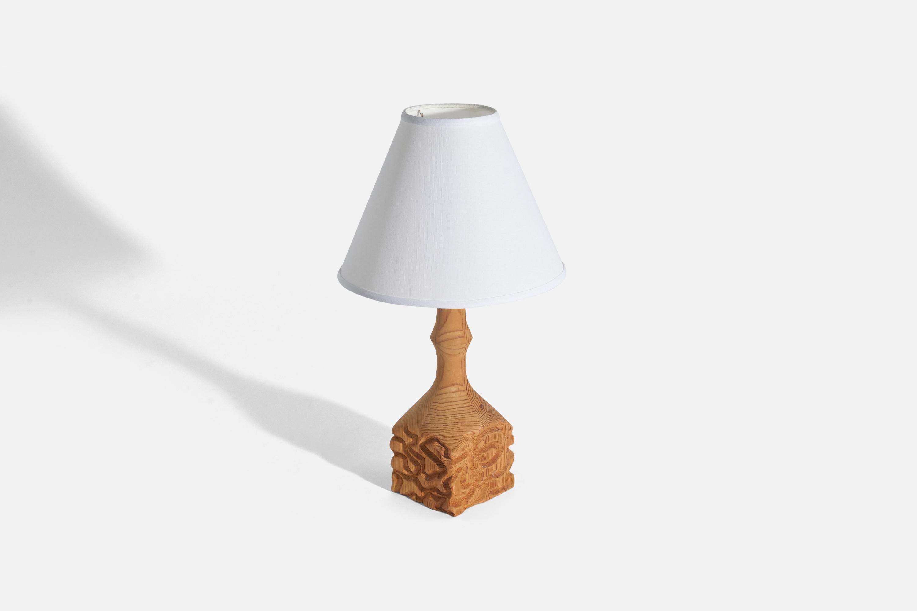 A pine table lamp designed and produced in Sweden, 1970s.

Sold without Lampshade(s)
Dimensions of Lamp (inches) : 13.62 x 4.24 x 4.07 (Height x Width x Depth)
Dimensions of Shade (inches) : 4 x 10 x 8 (Top Diameter x Bottom Diameter x