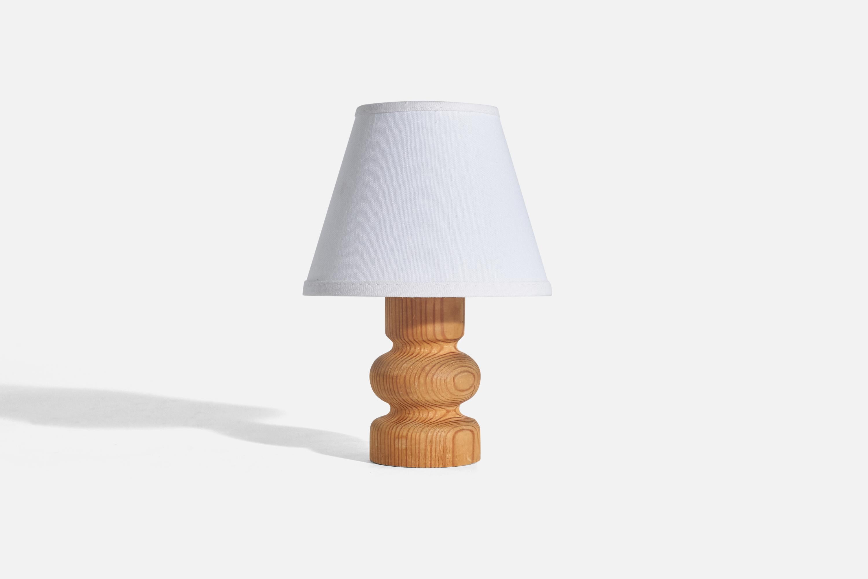A pine table lamp designed and produced in Sweden, 1970s.

Sold without lampshade(s)
Dimensions of lamp (inches) : 6.12 x 2.6 x 2.6 (Height x Width x Depth)
Dimensions of shade (inches) : 3.25 x 5.75 x 4.56 (Top Diameter x Bottom Diameter x