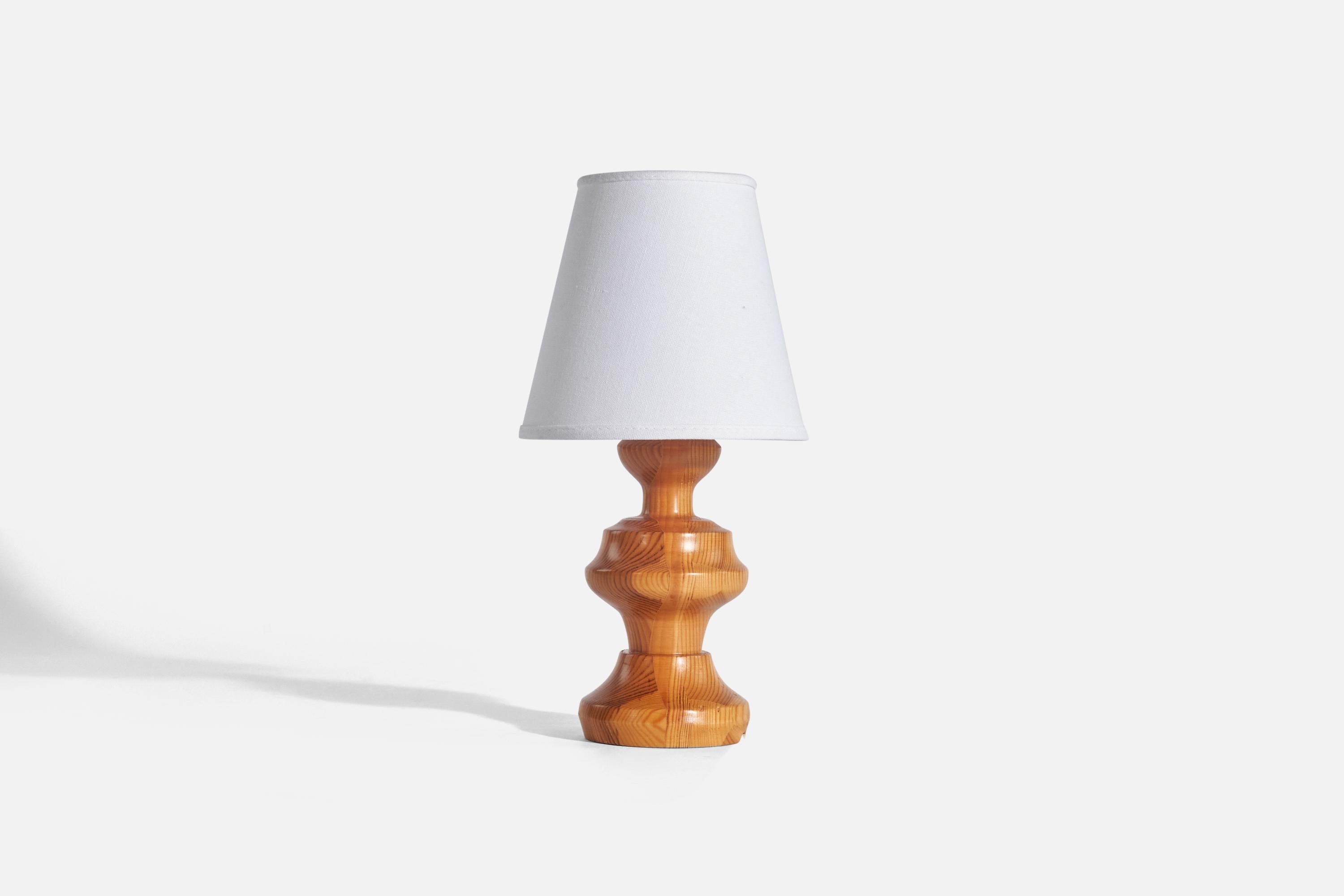 A pine table lamp designed and produced in Sweden, 1970s.

Sold without Lampshade(s)
Dimensions of Lamp (inches) : 9.56 x 4.10 x 4.10 (Height x Width x Depth)
Dimensions of Shade (inches) : 4 x 6.87 x 6.31 (Top Diameter x Bottom Diameter x