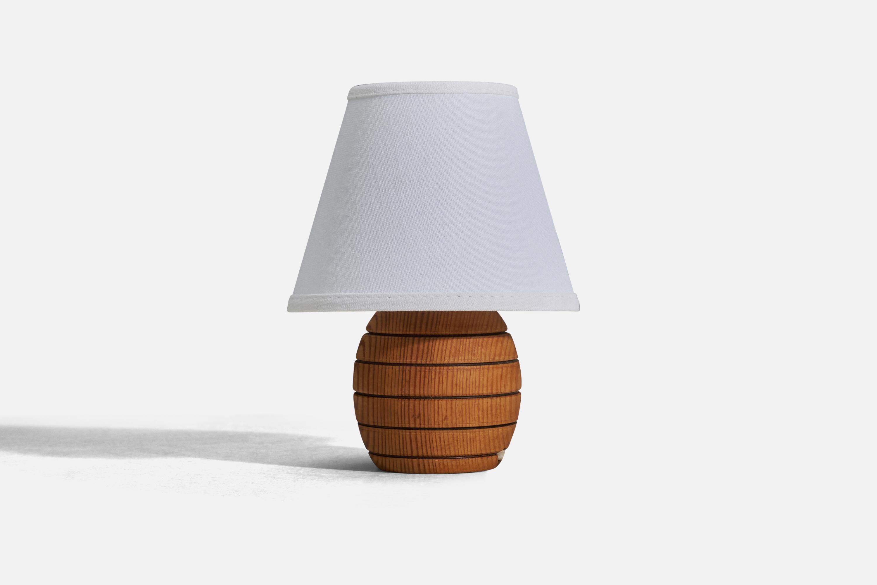 A pine table lamp designed and produced in Sweden, 1970s. 

Sold without Lampshade
Dimensions of Lamp (inches) : 4.75 x 3.35 x 3.35 (Height x Width x Depth)
Dimensions of Lampshade (inches) : 3.25 x 5.75 x 4.5 (Top Diameter x Bottom Diameter x