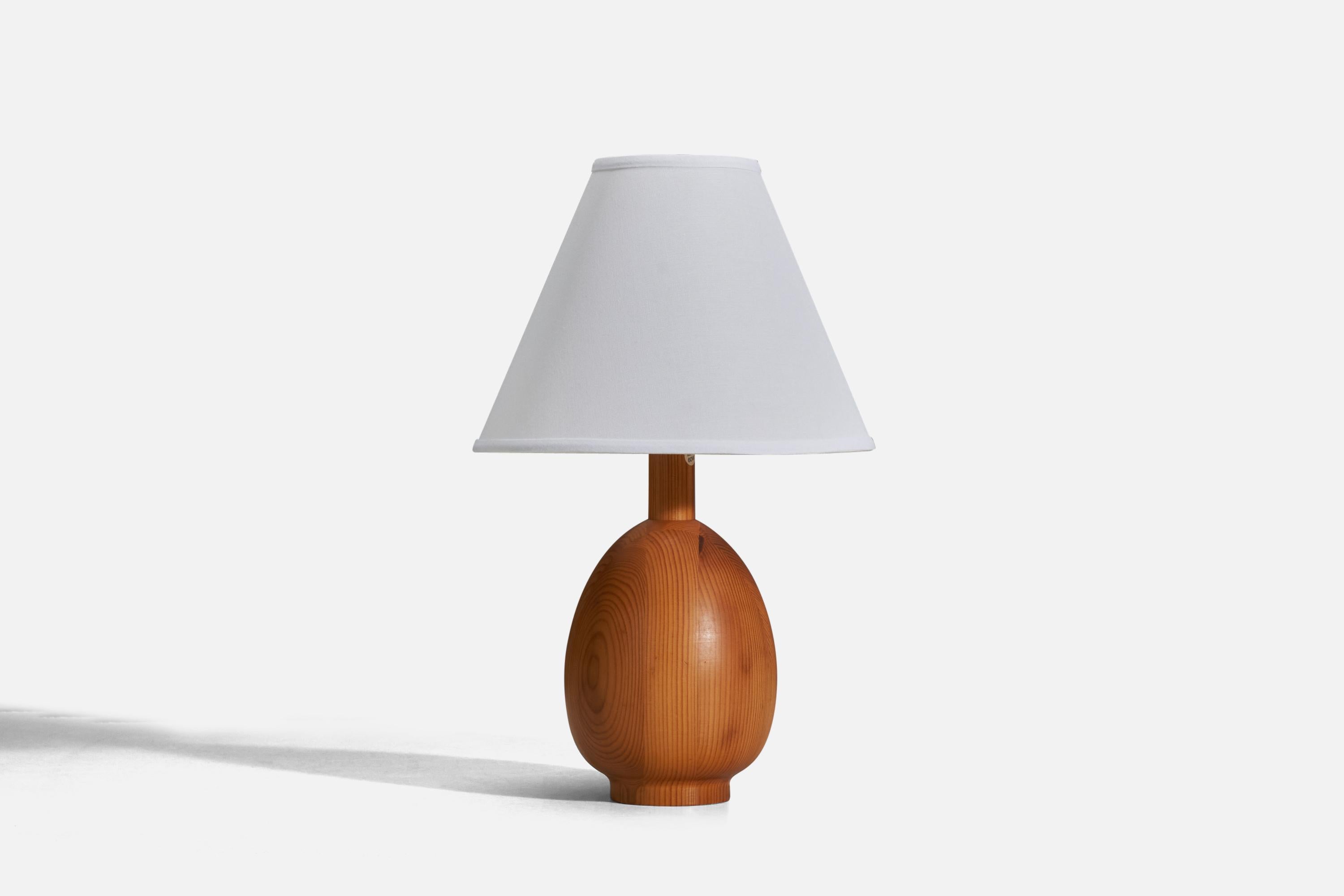 A pine table lamp designed and produced in Sweden, 1970s.

Sold without Lampshade
Dimensions of Lamp (inches) : 11.25 x 5.43 x 5.43 (Height x Width x Depth)
Dimensions of Lampshade (inches) : 4 x 10 x 8 (Top Diameter x Bottom Diameter x